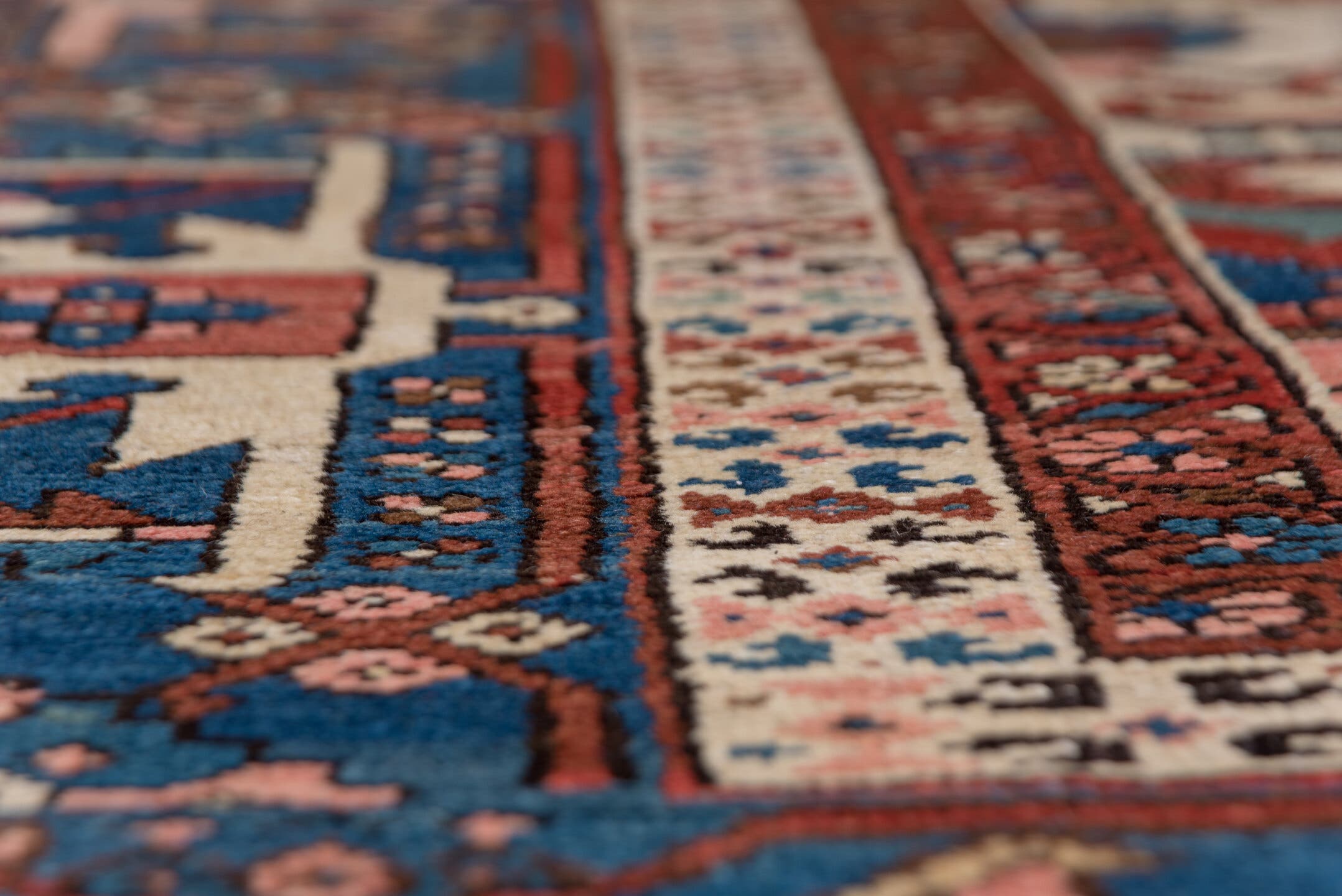 10' x 14' one-of-a-kind handmade antique Serapi large size rug. Color palette: rust, ivory, indigo, sky blue, rose, taupe