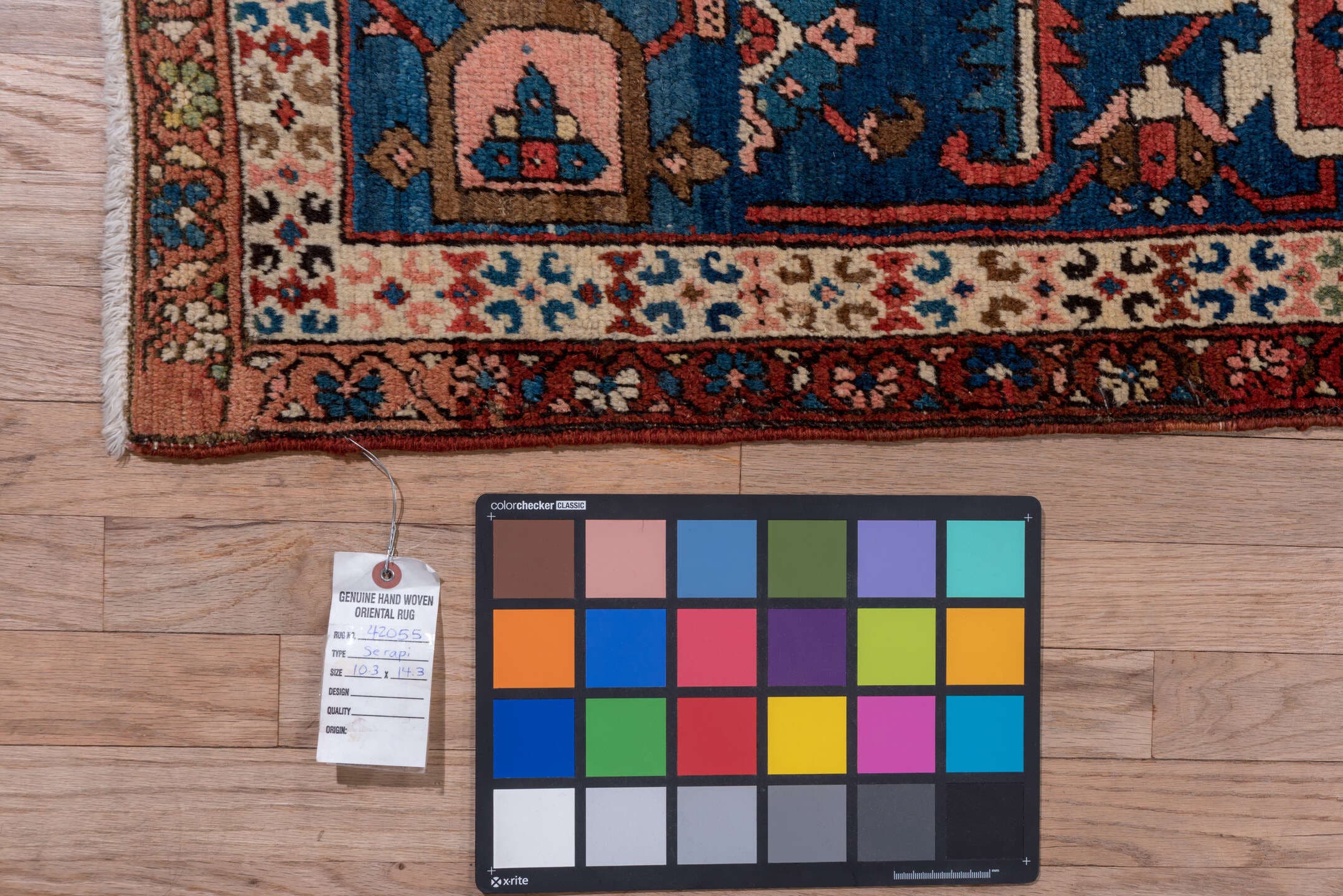10' x 14' one-of-a-kind handmade antique Serapi large size rug. Color palette: rust, ivory, indigo, sky blue, rose, taupe