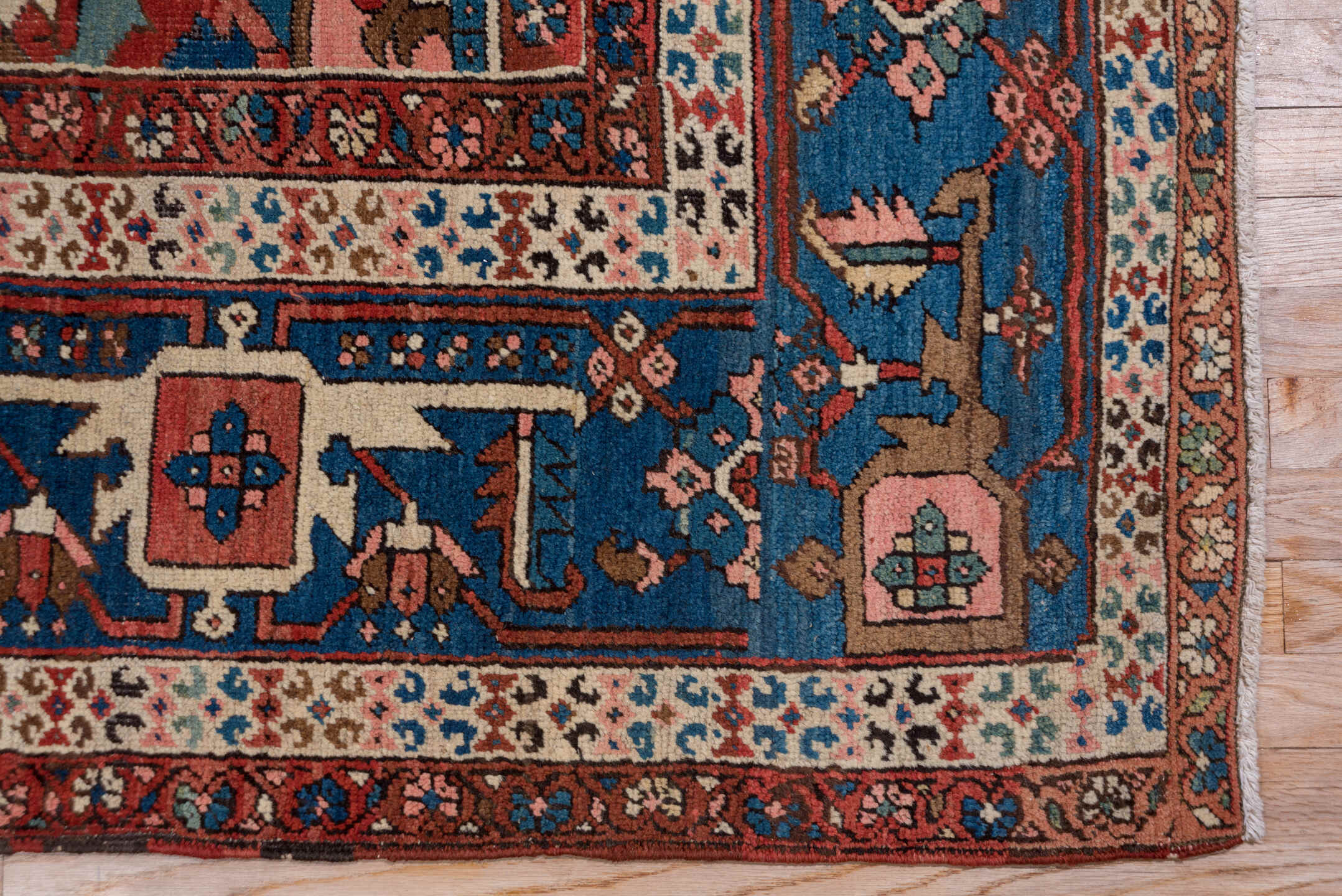 10' x 14' one-of-a-kind handmade antique Serapi large size rug. Color palette: rust, ivory, indigo, sky blue, rose, taupe