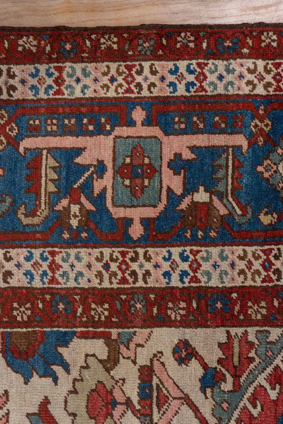 10' x 14' one-of-a-kind handmade antique Serapi large size rug. Color palette: rust, ivory, indigo, sky blue, rose, taupe