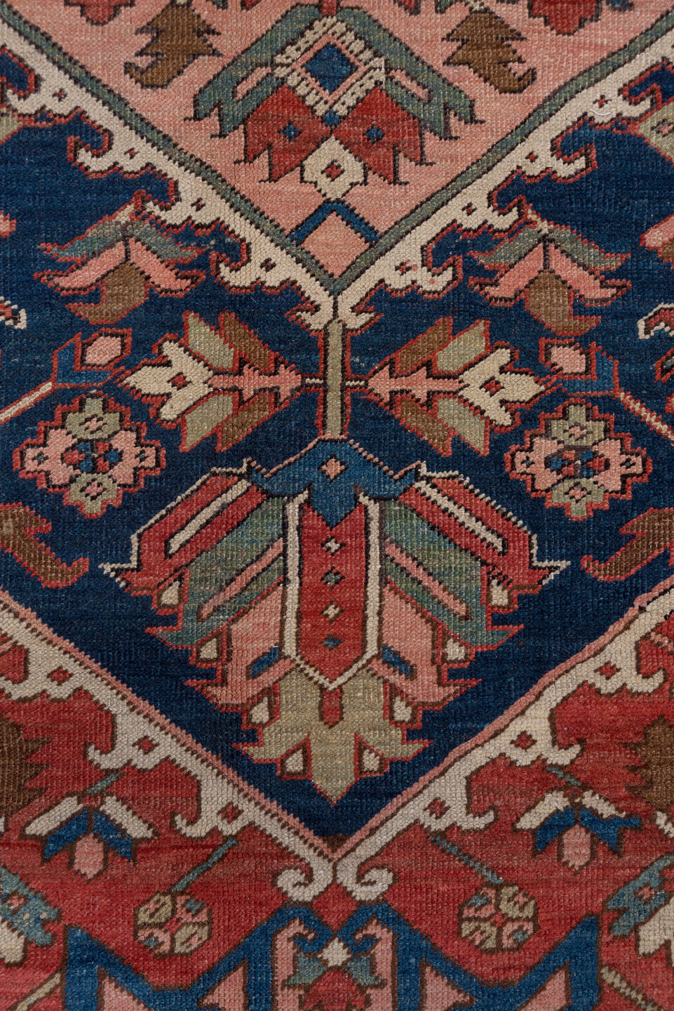 10' x 14' one-of-a-kind handmade antique Serapi large size rug. Color palette: rust, ivory, indigo, sky blue, rose, taupe