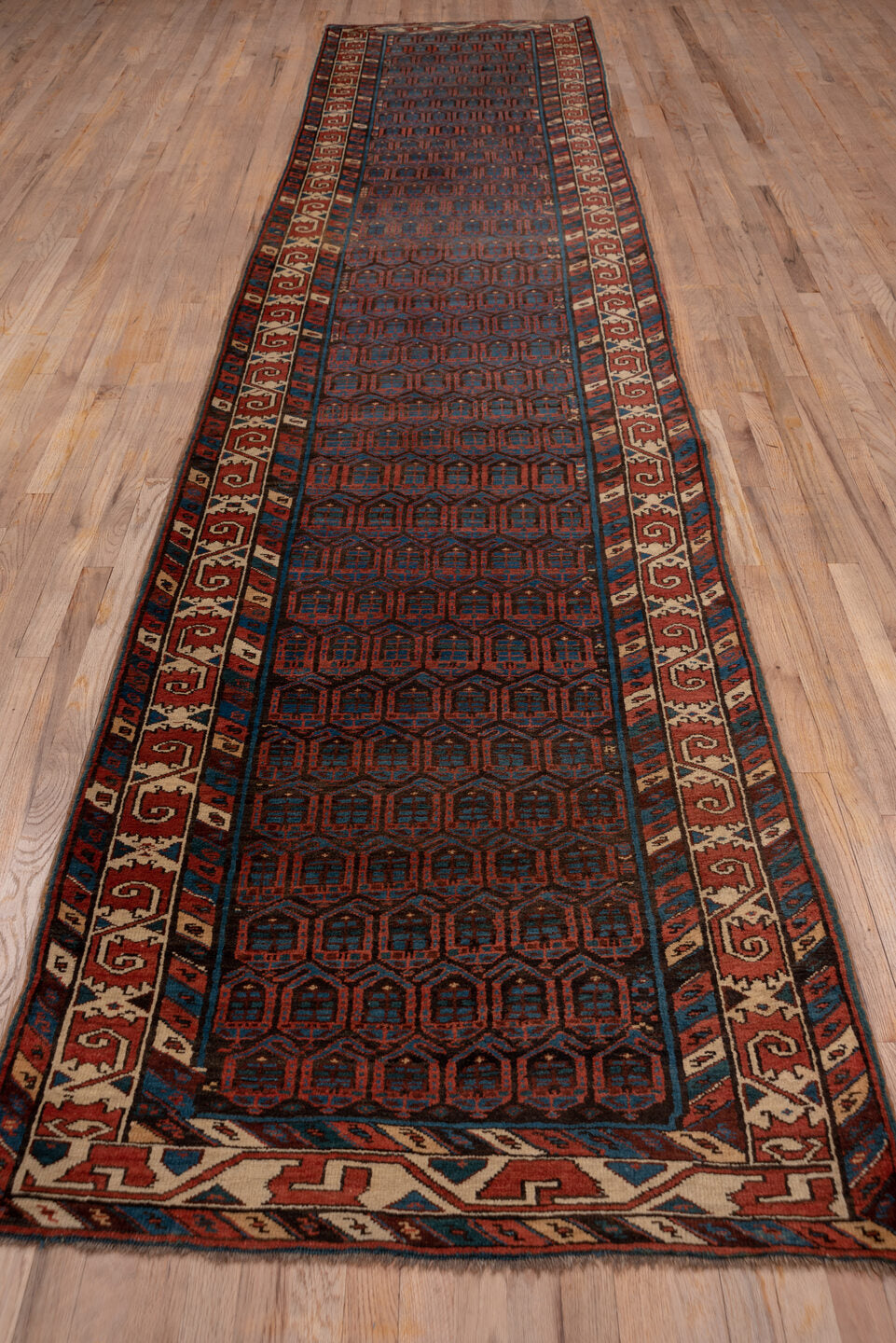 3' x 15' one-of-a-kind handmade vintage Sarab runner rug. Color palette: black, blue, brown, charcoal, gray, off-white, red