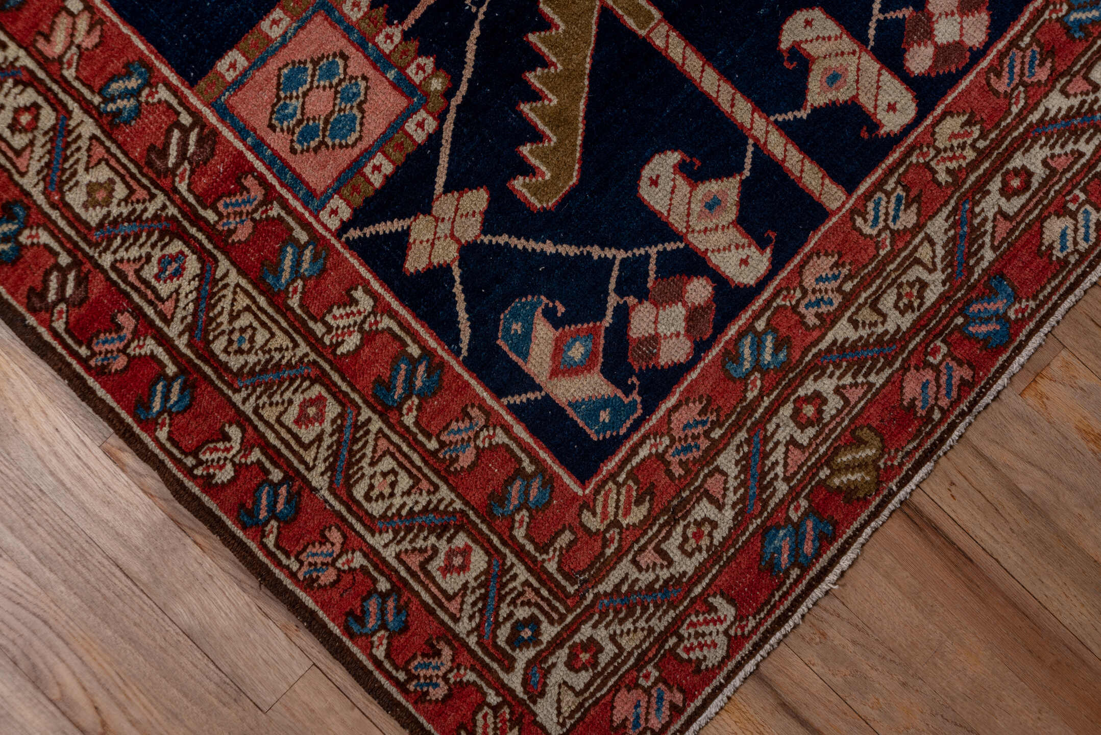 3' x 11' one-of-a-kind handmade vintage Serapi runner rug. Color palette: blue, brown, gray, pink, red