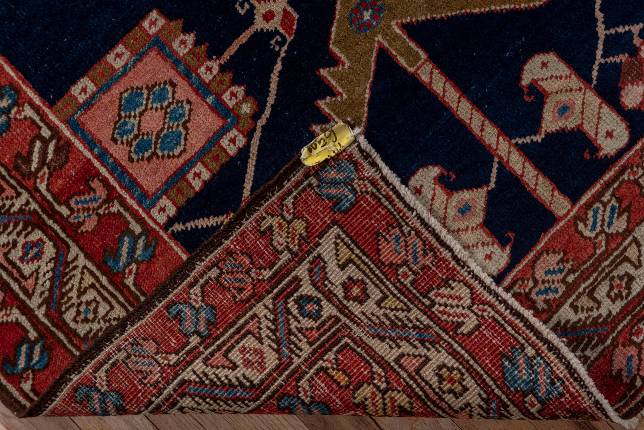 3' x 11' one-of-a-kind handmade vintage Serapi runner rug. Color palette: blue, brown, gray, pink, red