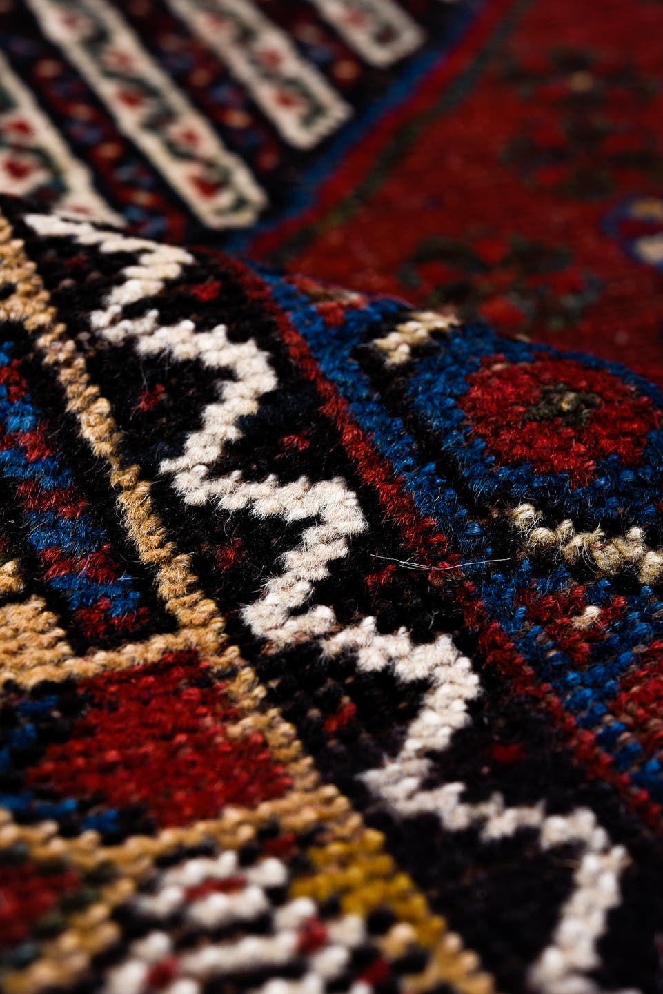 5' x 8' one-of-a-kind handmade antique Qashqai medium size rug. Color palette: rust, indigo, ivory, gold, navy, brown