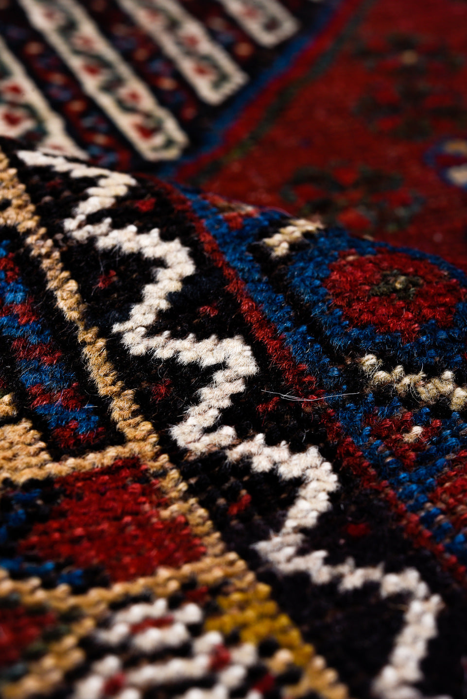 5' x 8' one-of-a-kind handmade antique Qashqai medium size rug. Color palette: rust, indigo, ivory, gold, navy, brown