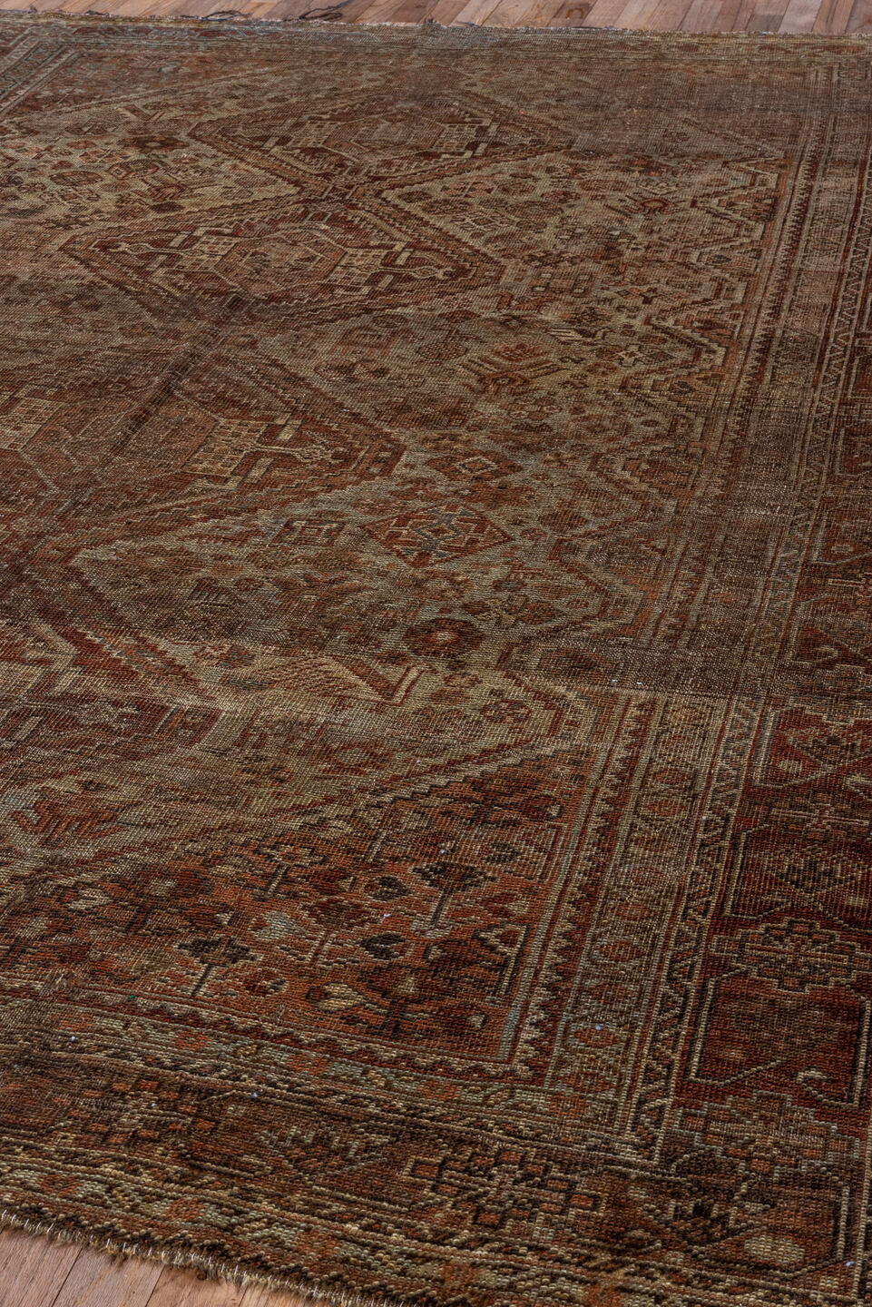 6' x 9' one-of-a-kind handmade antique Shiraz large size rug. Color palette: brown, rust, camel, ivory, taupe, mahogany