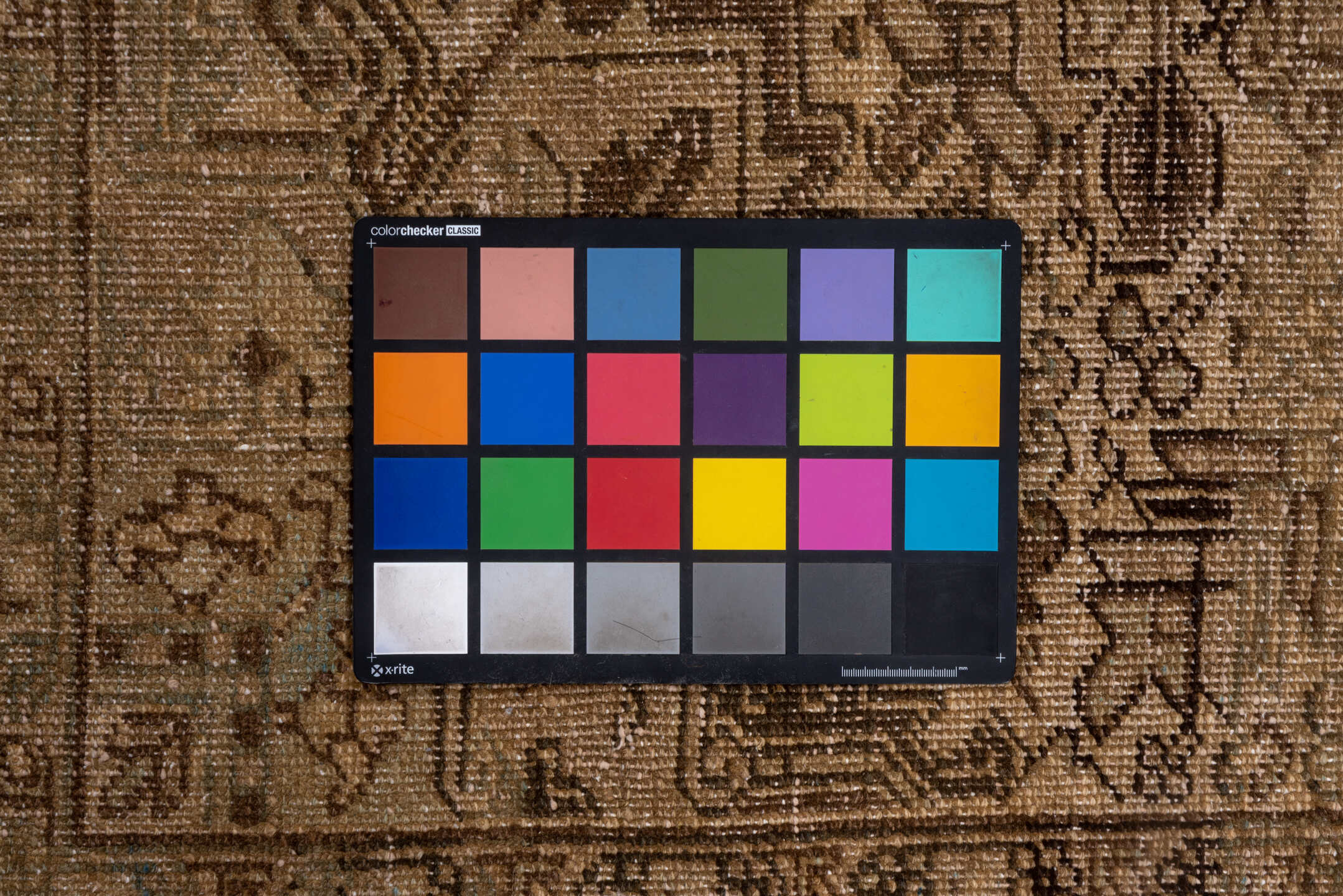 7' x 9' one-of-a-kind handmade vintage Heriz rug. Color palette: black, brown, gray, light gray, off-white, orange, pink