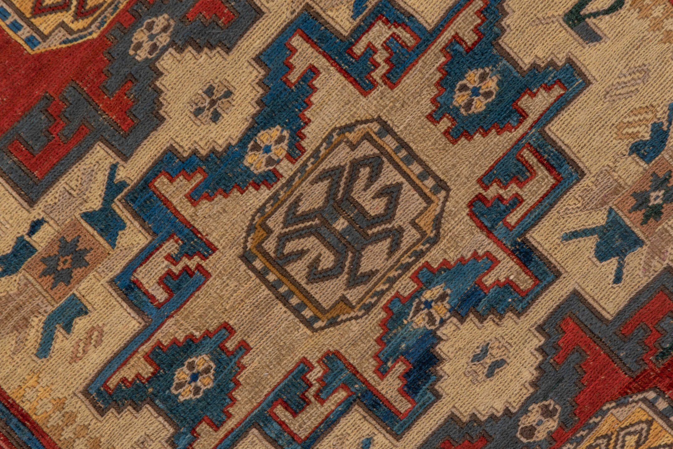 3' x 8' one-of-a-kind handmade antique Sumak runner rug. Color palette: ivory, rust, indigo, blue, gold, sage, camel