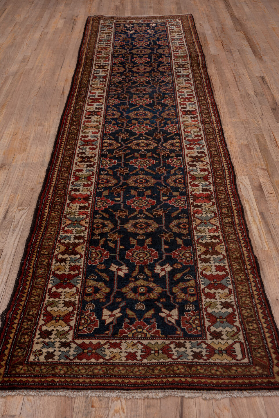 3' x 12' one-of-a-kind handmade antique Malayer runner rug. Color palette: navy, ivory, rust, camel, burgundy, taupe, brown