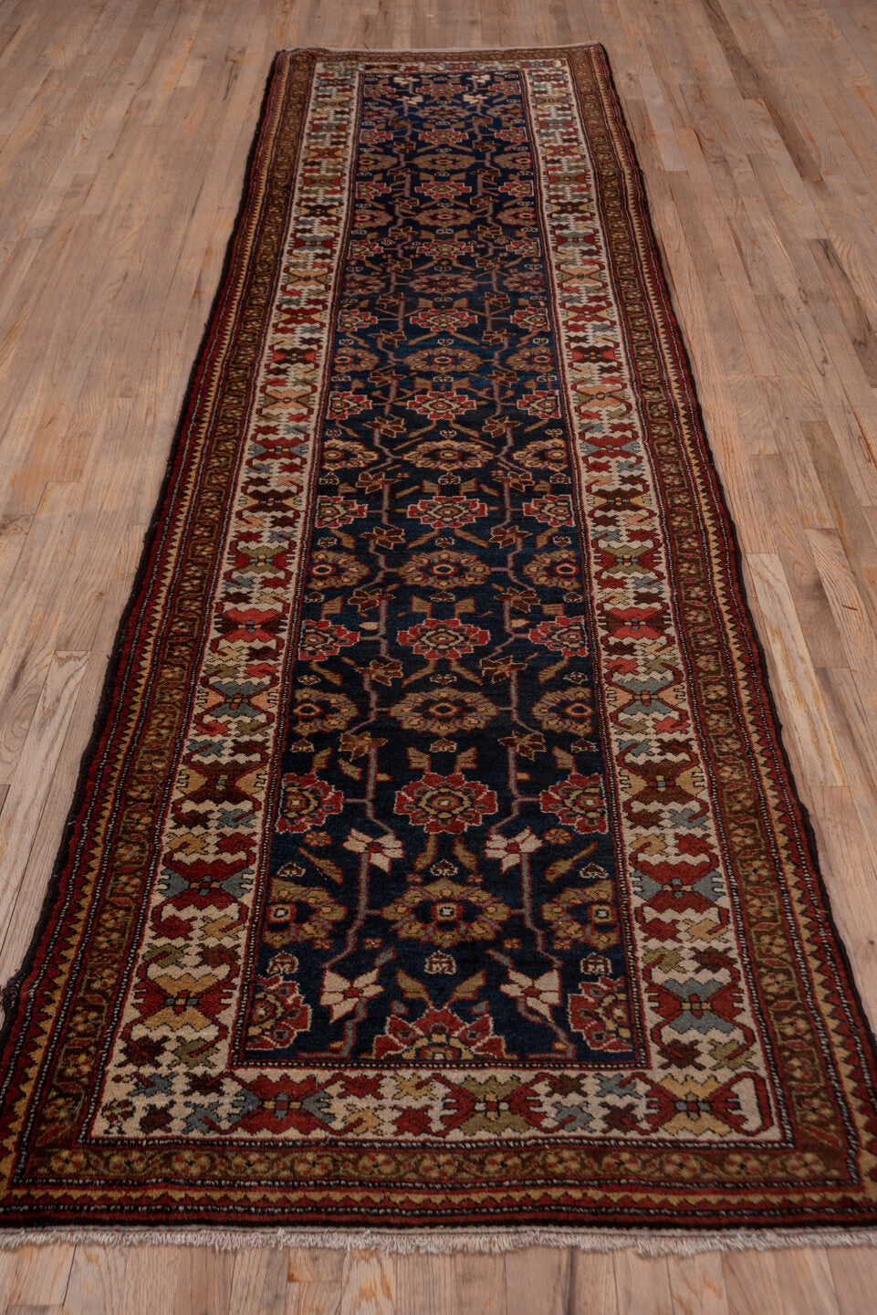 3' x 12' one-of-a-kind handmade antique Malayer runner rug. Color palette: navy, ivory, rust, camel, burgundy, taupe, brown