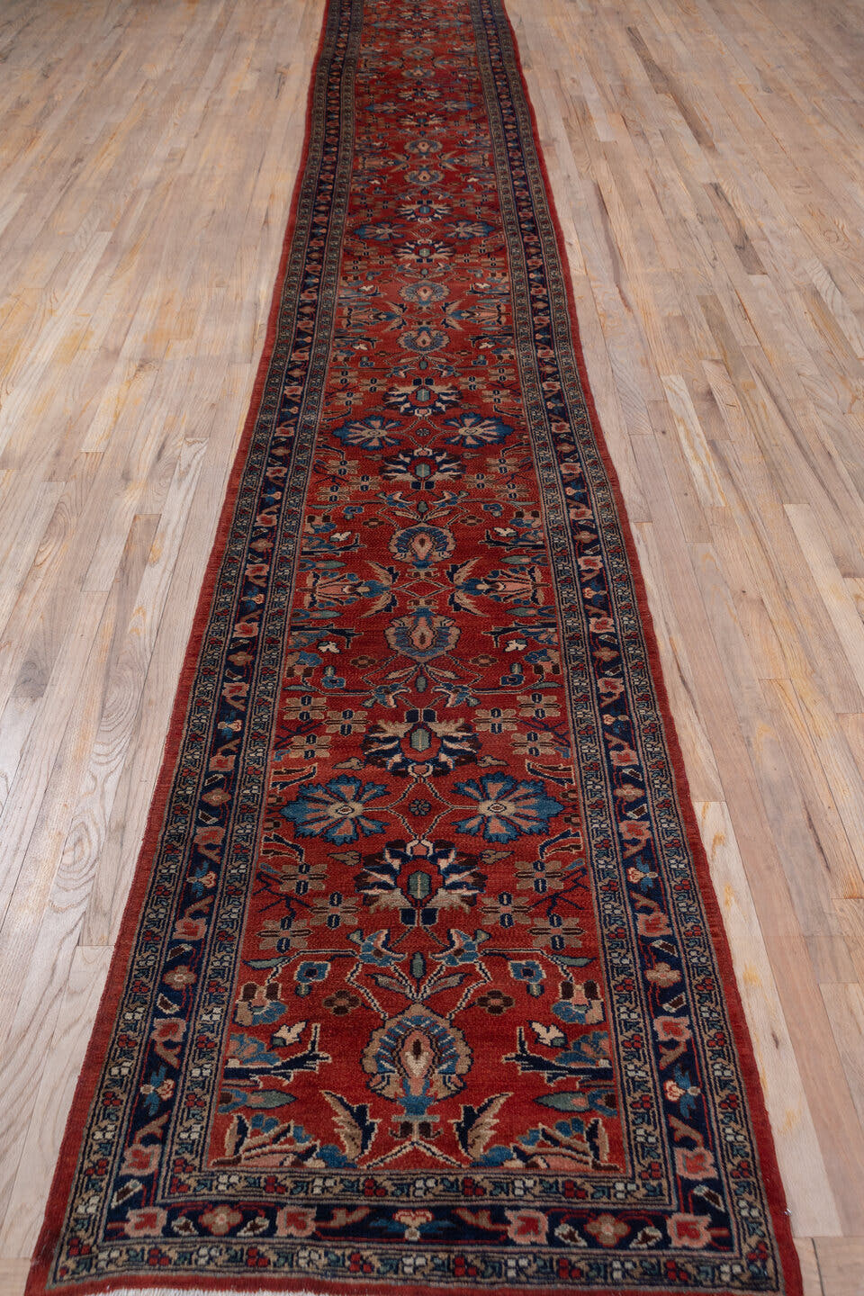 2' x 19' one-of-a-kind handmade antique Lilian runner rug. Color palette: rust, navy, ivory, camel, slate, terracotta, brown