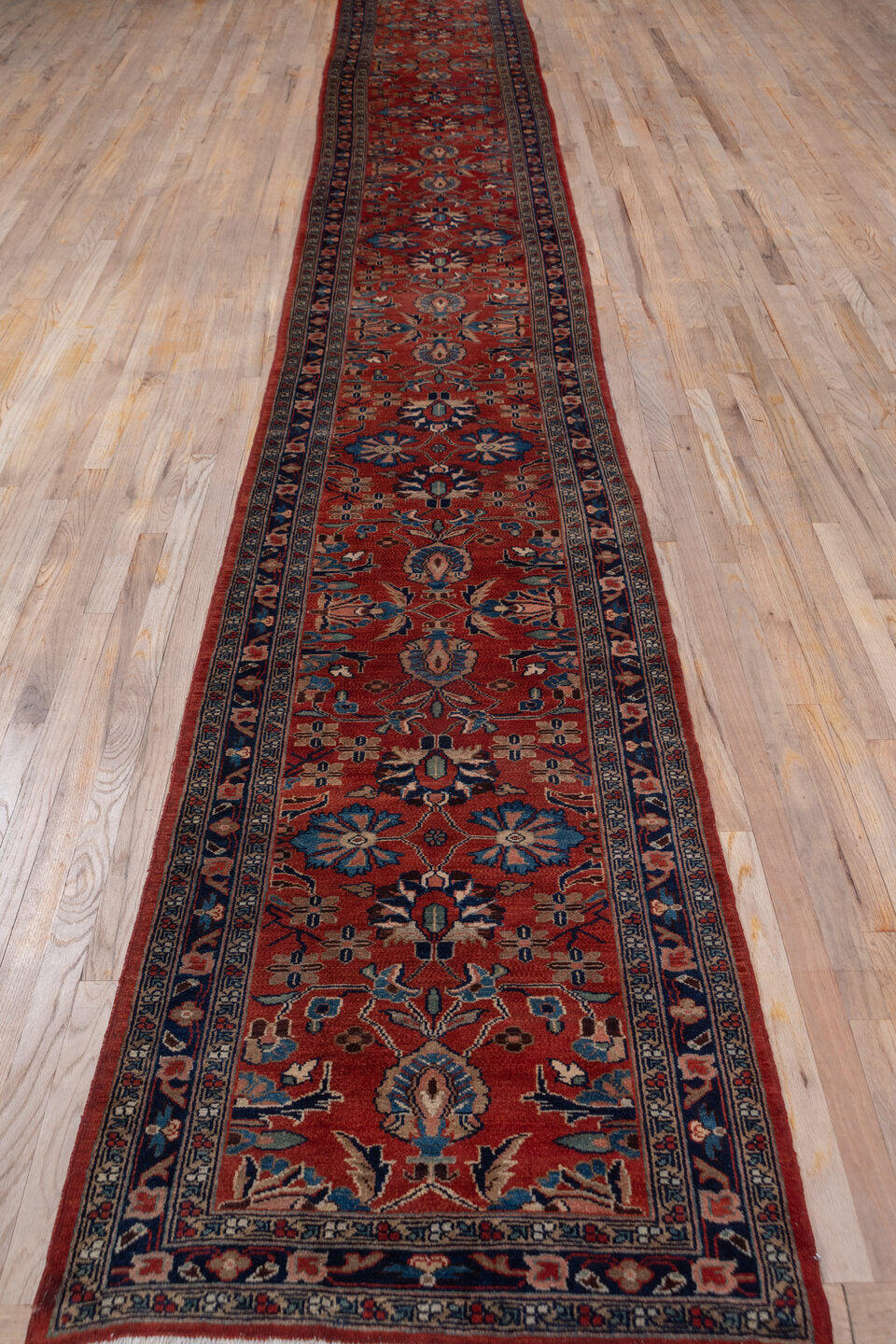 2' x 19' one-of-a-kind handmade antique Lilian runner rug. Color palette: rust, navy, ivory, camel, slate, terracotta, brown