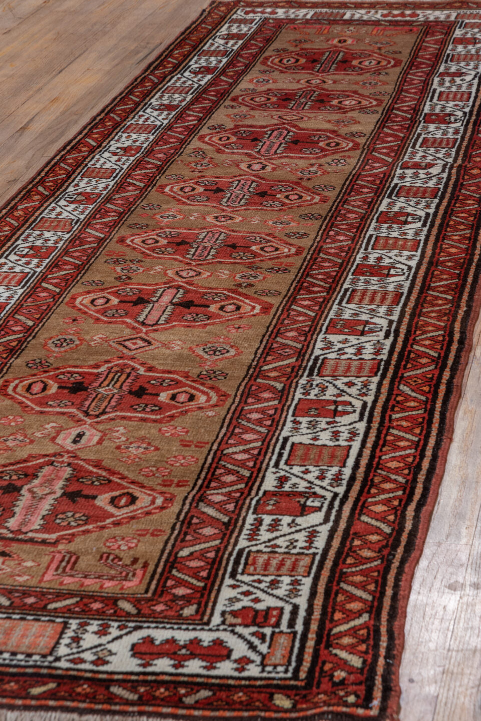 3' x 10' one-of-a-kind handmade vintage Sarab runner rug. Color palette: brown, gray, light gray, maroon, off-white, pink