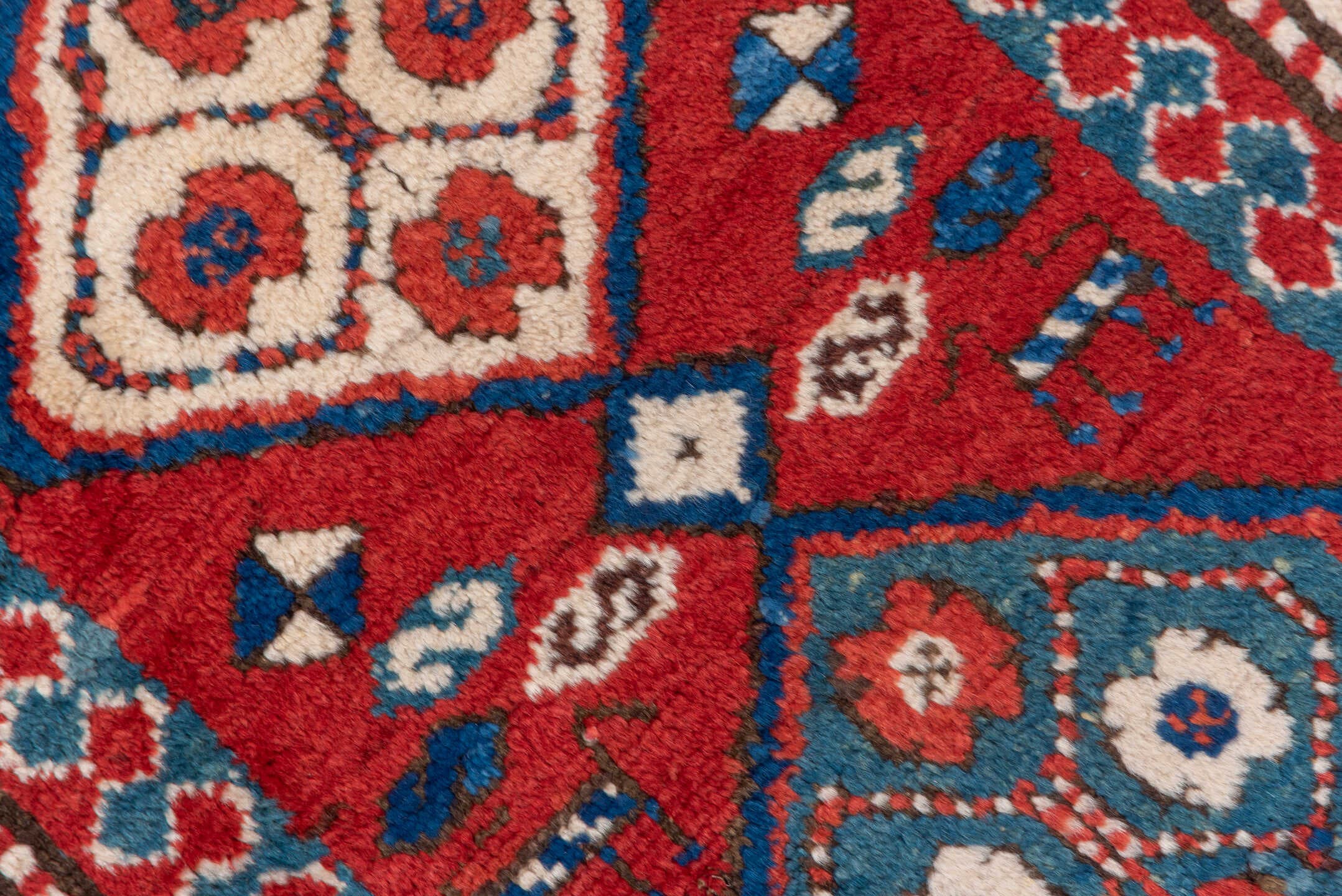 3' x 8' one-of-a-kind handmade vintage Kazak runner rug. Color palette: red, ivory, blue, rust, navy, turquoise, brown