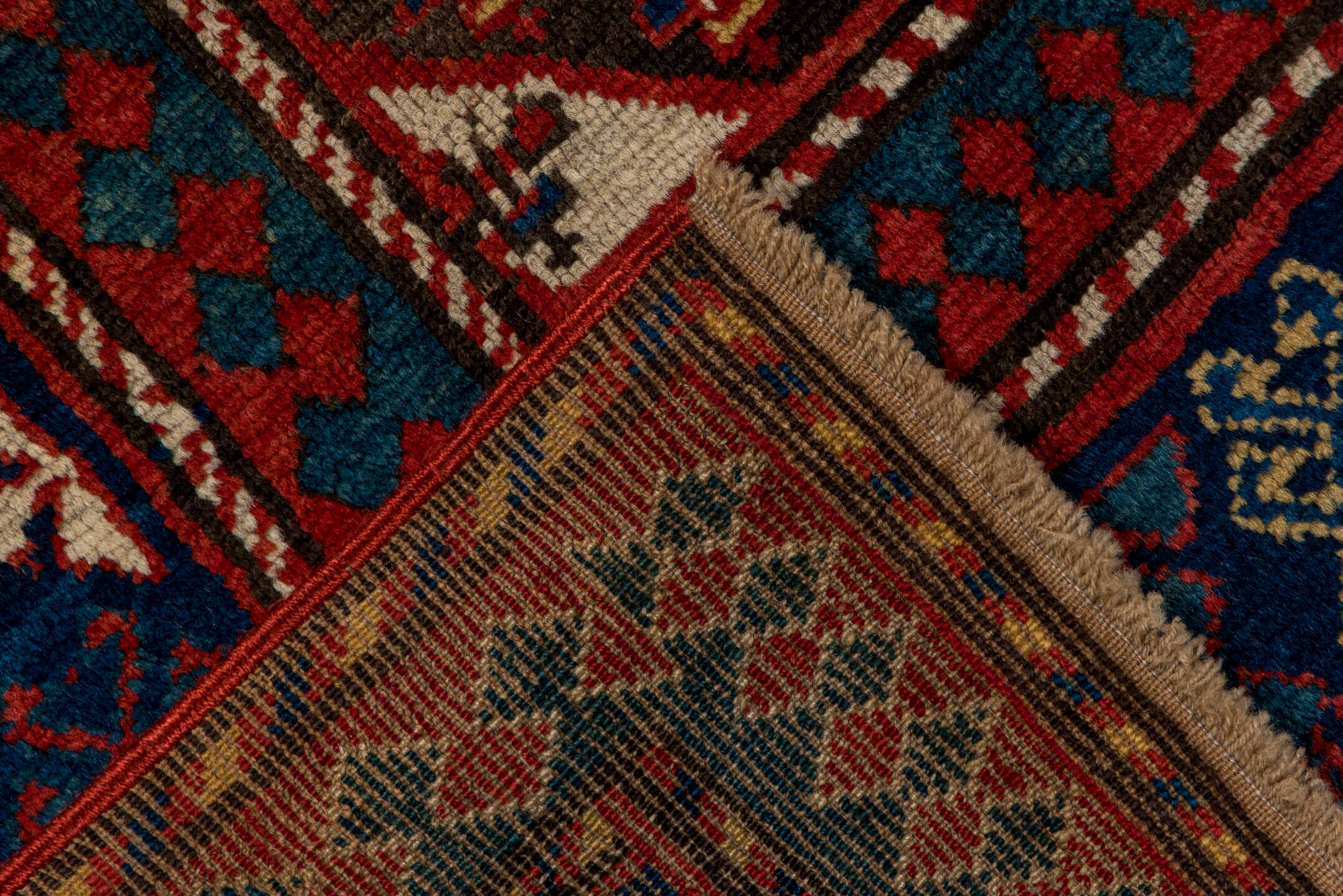 3' x 7' one-of-a-kind handmade vintage Kazak rug. Color palette: ivory, navy, teal, rust, crimson, gold, blue, terracotta