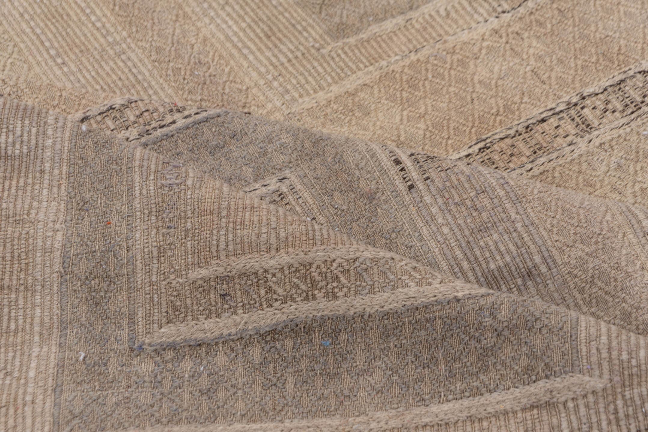 5' x 9' one-of-a-kind handmade vintage Jijim medium size rug. Color palette: taupe, beige, ivory, camel, greige, gray