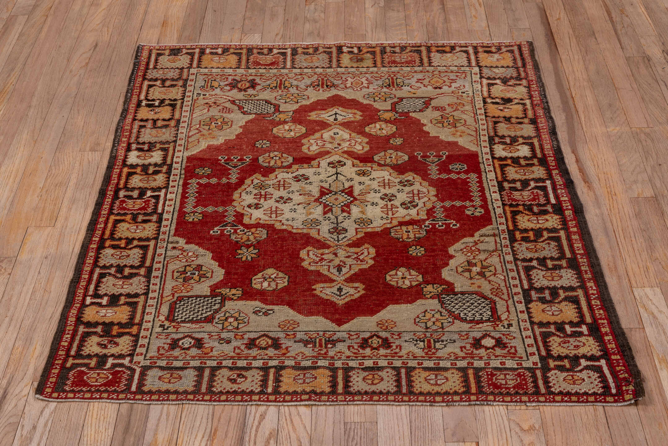 3' x 4' one-of-a-kind handmade vintage Oushak small size rug. Color palette: rust, ivory, burgundy, gold, camel, charcoal