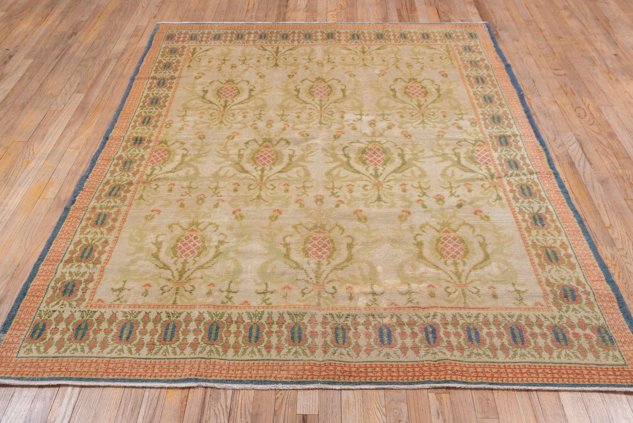 5' x 7' one-of-a-kind handmade antique Spanish rug. Color palette: ivory, olive, rose, gold, navy, sage, green, pink, red