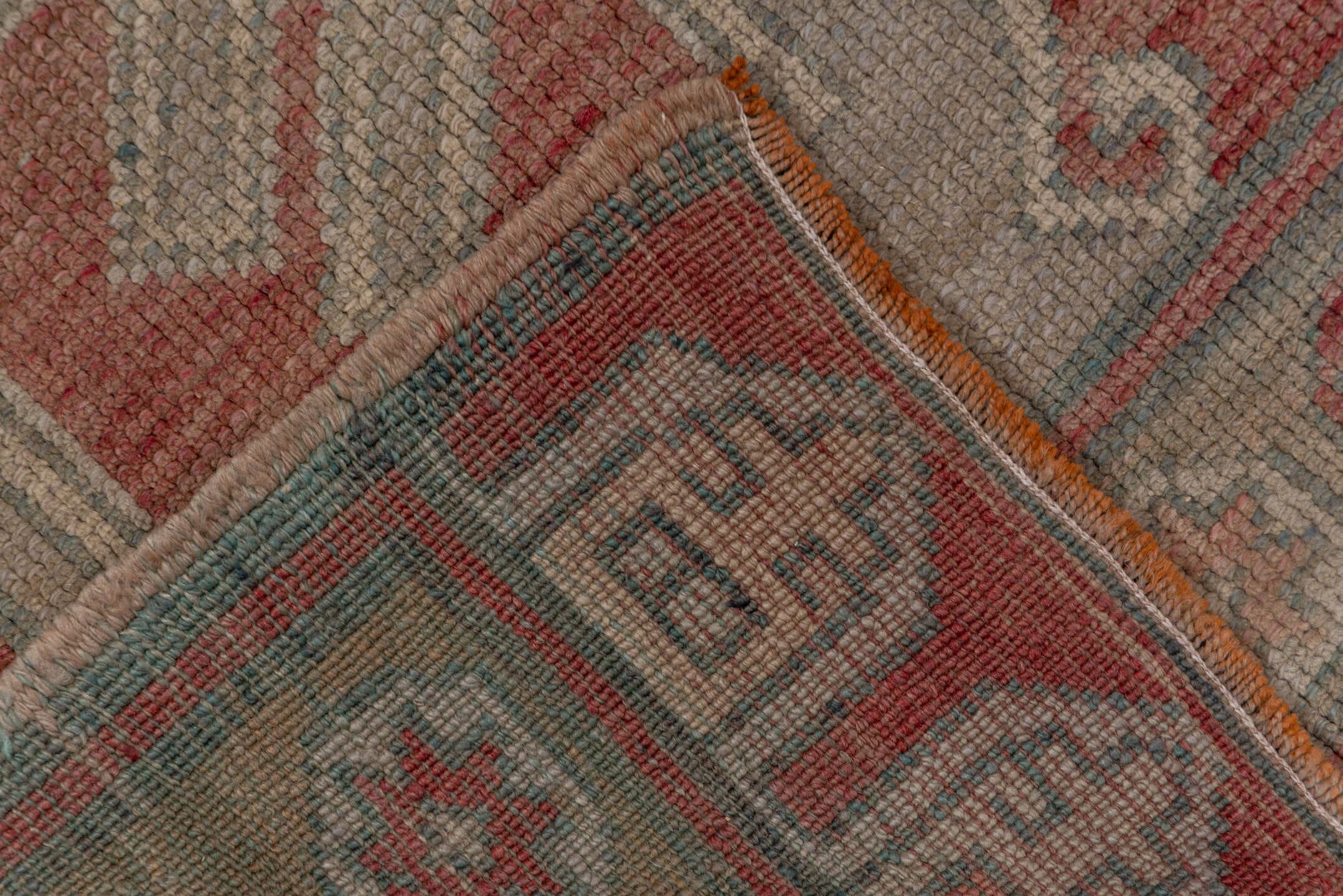 4' x 11' one-of-a-kind handmade vintage Oushak runner rug. Color palette: terra cotta, taupe, sage, ivory, rose, charcoal