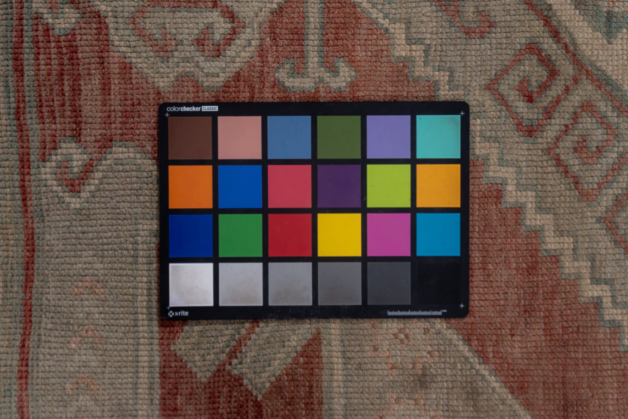 4' x 11' one-of-a-kind handmade vintage Oushak runner rug. Color palette: black, brown, gray, off-white, pink, red, snow