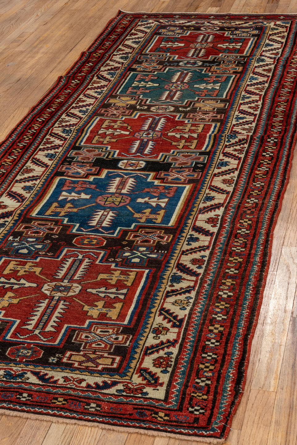 3' x 9' one-of-a-kind handmade vintage Malayer runner rug. Color palette: red, ivory, blue, charcoal, camel, rust, teal