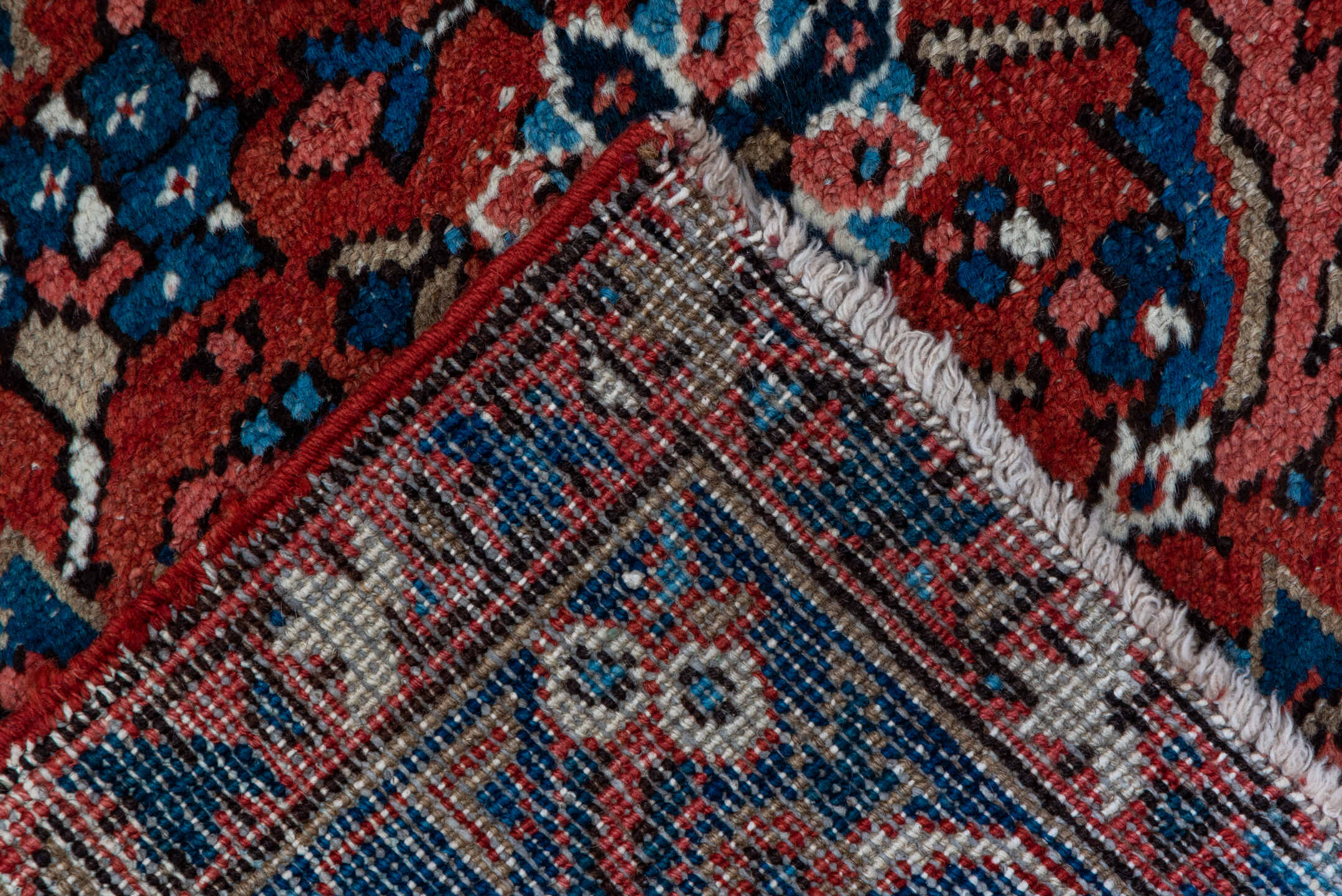 3' x 12' one-of-a-kind handmade vintage Heriz runner rug. Color palette: blue, brown, gray, orange, pink, red, wine