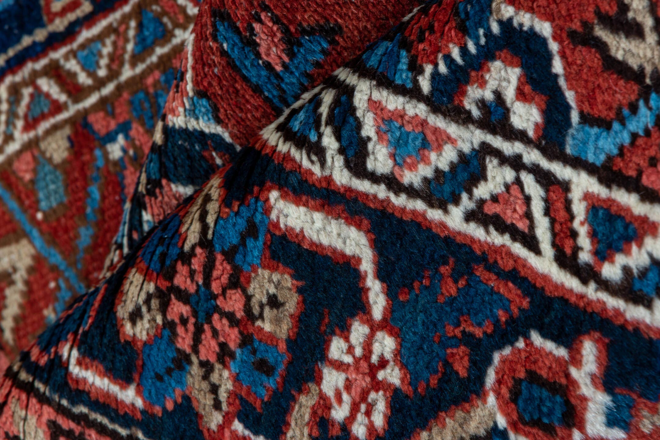 3' x 12' one-of-a-kind handmade vintage Heriz runner rug. Color palette: rust, navy, ivory, sky blue, rose, camel