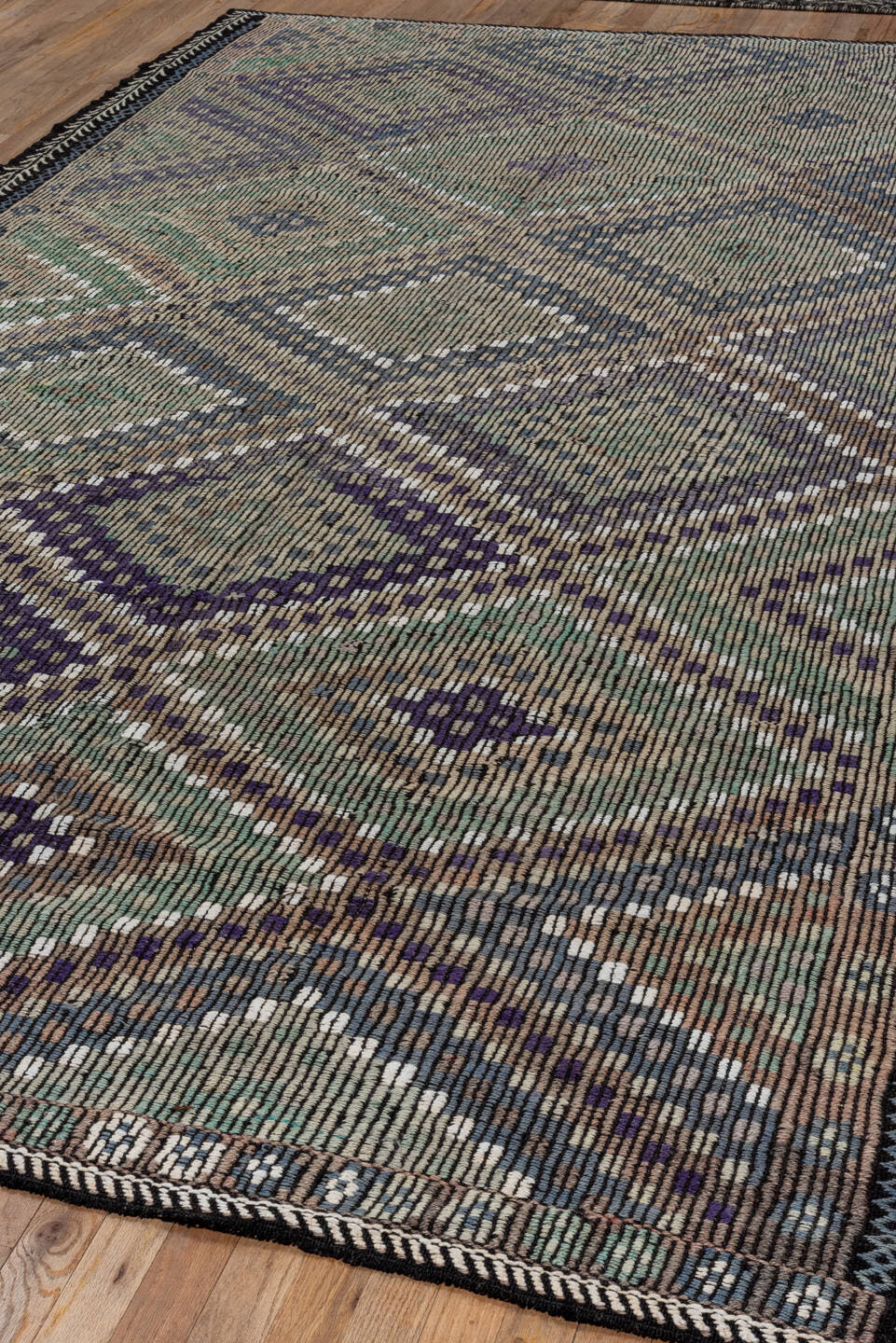 6' x 11' one-of-a-kind handmade vintage Jijim large size rug. Color palette: taupe, indigo, ivory, violet, sage, brown
