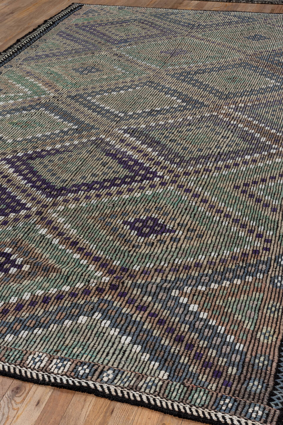 6' x 11' one-of-a-kind handmade vintage Jijim large size rug. Color palette: taupe, indigo, ivory, violet, sage, brown