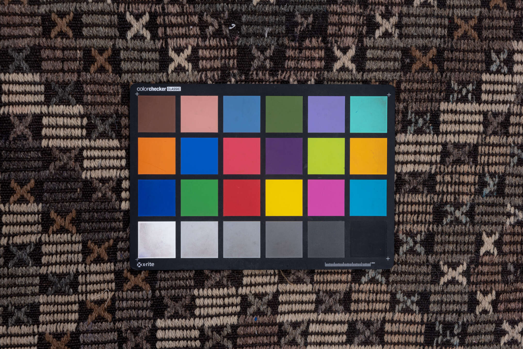 7' x 9' one-of-a-kind handmade vintage Jijim rug. Color palette: black, brown, charcoal, dark gray, dim gray, gray, pink