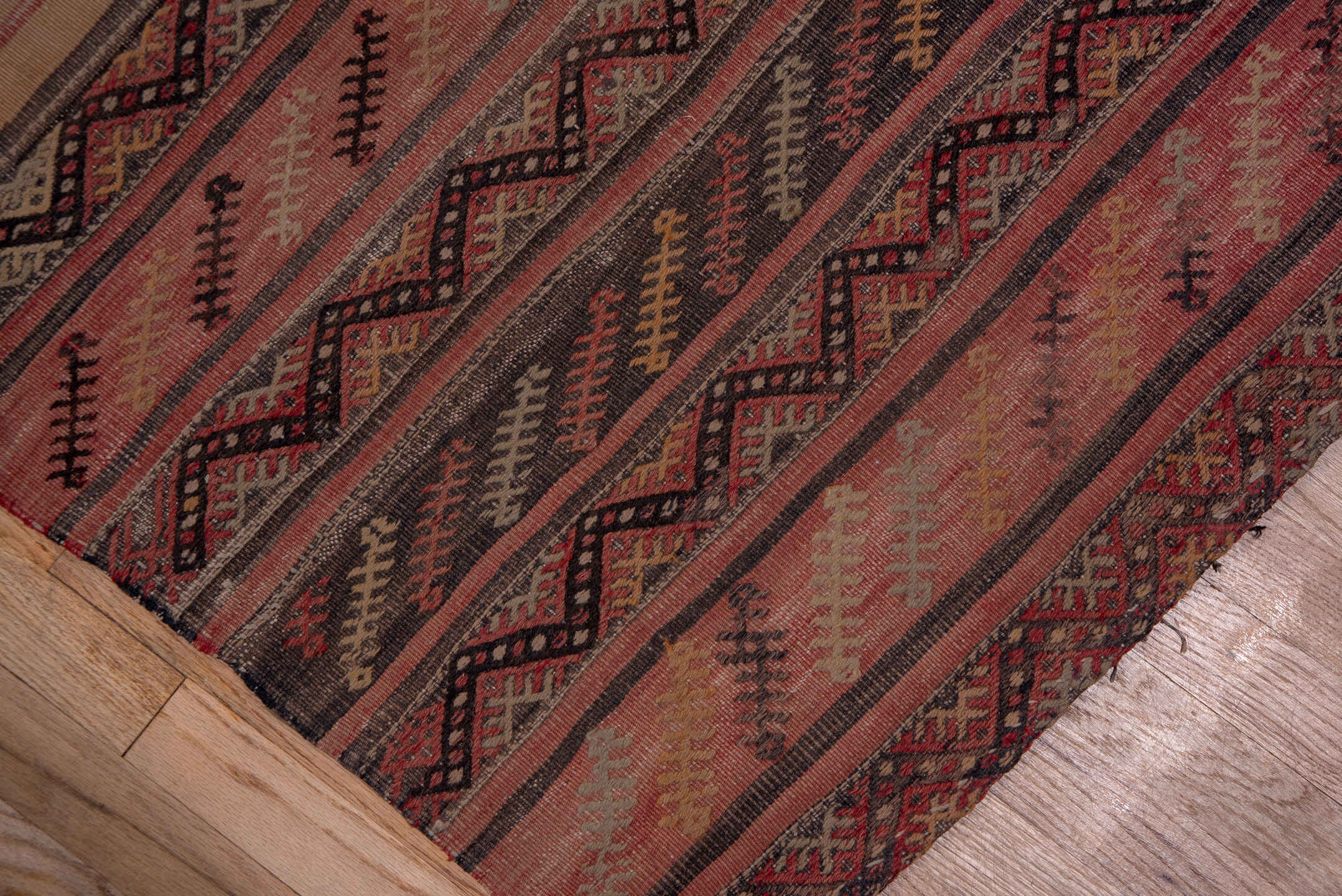 2' x 15' one-of-a-kind handmade vintage Jijim runner rug. Color palette: brown, gray, off-white, pink, red, redwood, snow