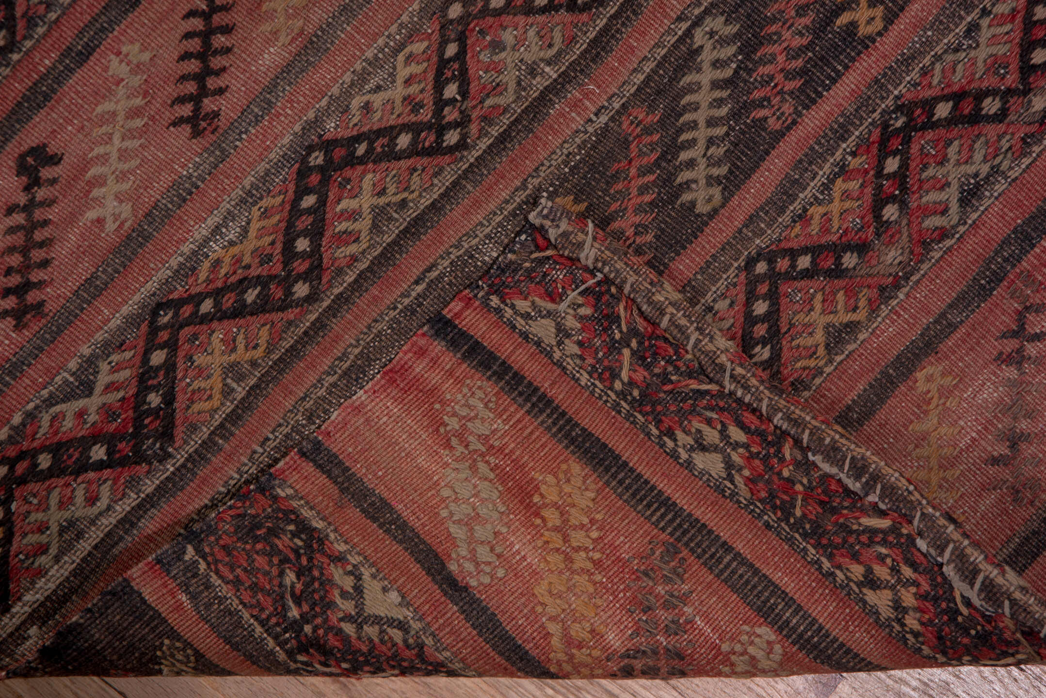 2' x 15' one-of-a-kind handmade vintage Jijim runner rug. Color palette: brown, gray, off-white, pink, red, redwood, snow