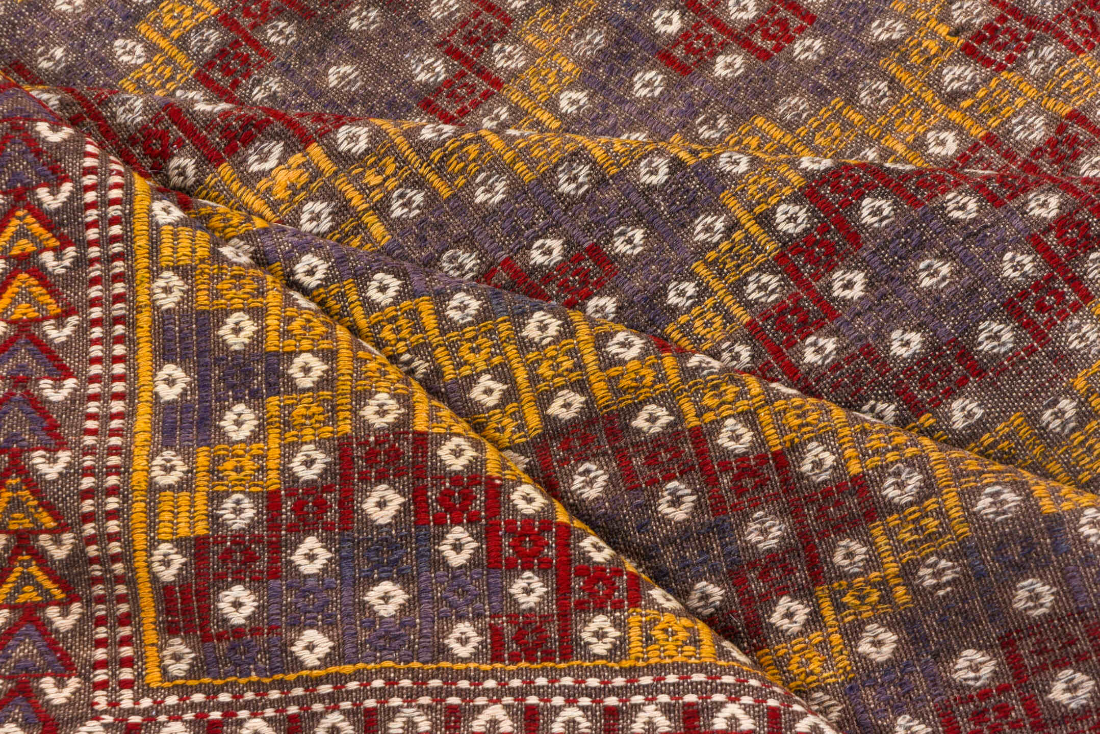 6' x 7' one-of-a-kind handmade vintage Jijim rug. Color palette: brown, gray, light gray, off-white, orange, pink, red, snow