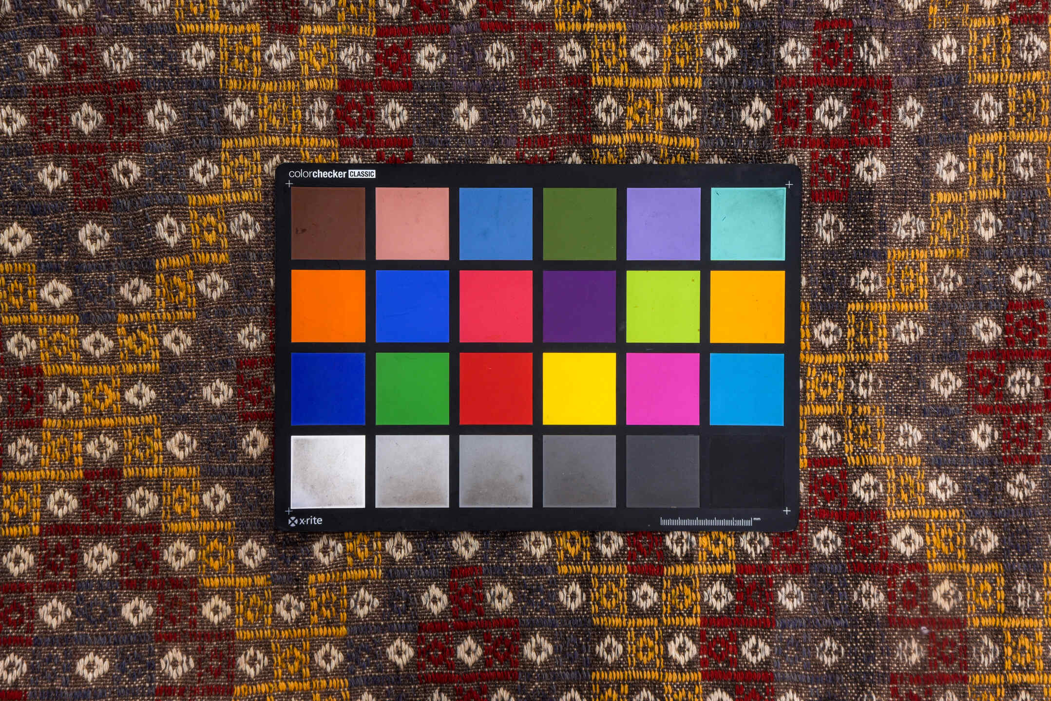 6' x 7' one-of-a-kind handmade vintage Jijim rug. Color palette: brown, gray, light gray, off-white, orange, pink, red, snow