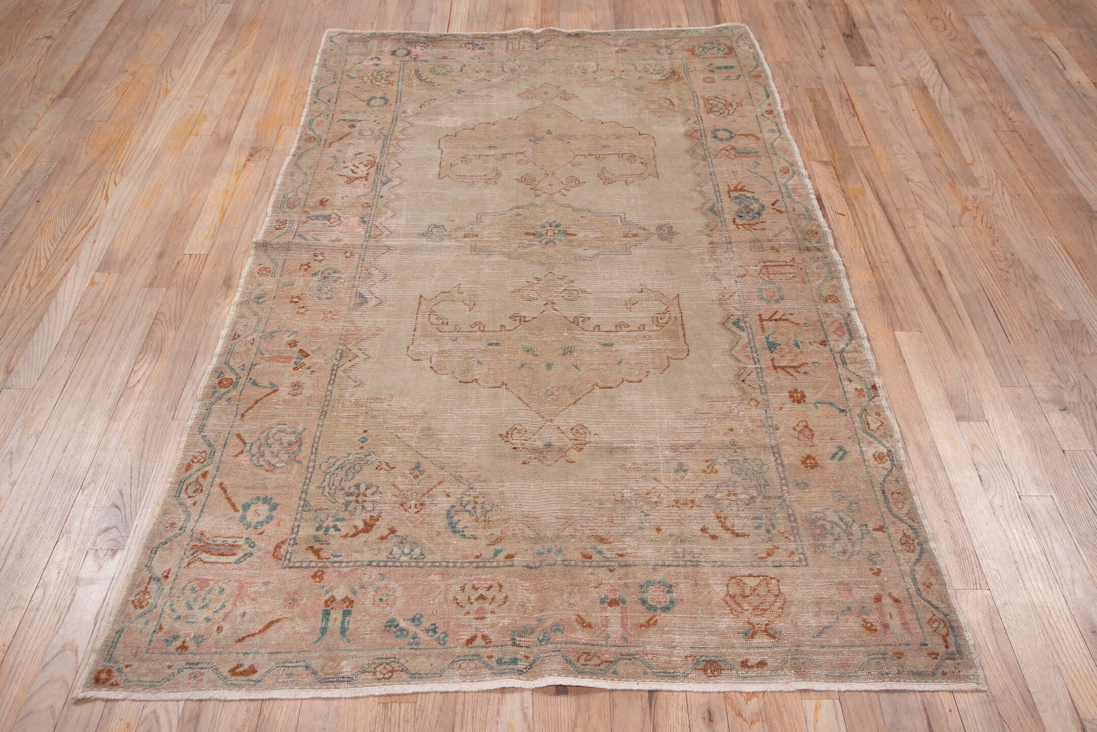 4' x 7' one-of-a-kind handmade antique Oushak rug. Color palette: blush, ivory, aqua, rust, taupe, sage, pink, teal