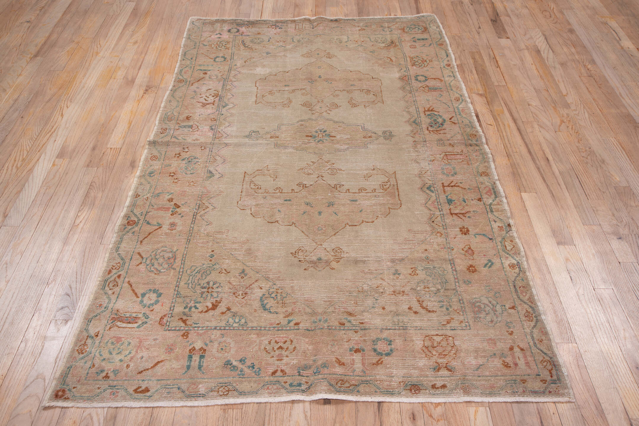 4' x 7' one-of-a-kind handmade antique Oushak rug. Color palette: blush, ivory, aqua, rust, taupe, sage, pink, teal