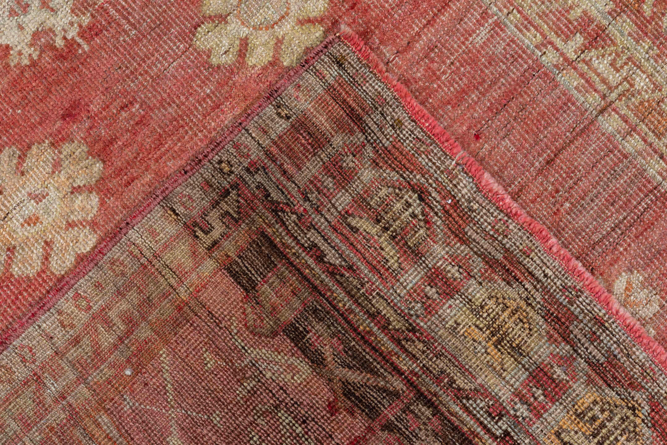 4' x 12' one-of-a-kind handmade vintage Oushak runner rug. Color palette: brown, maroon, pink, red
