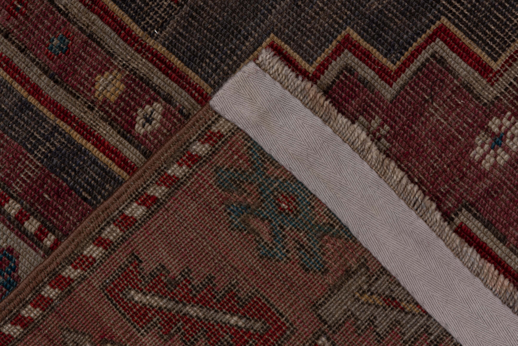 4' x 7' one-of-a-kind handmade antique Trans Caucasian rug. Color palette: rose, dusty rose, ivory, indigo, rust, taupe