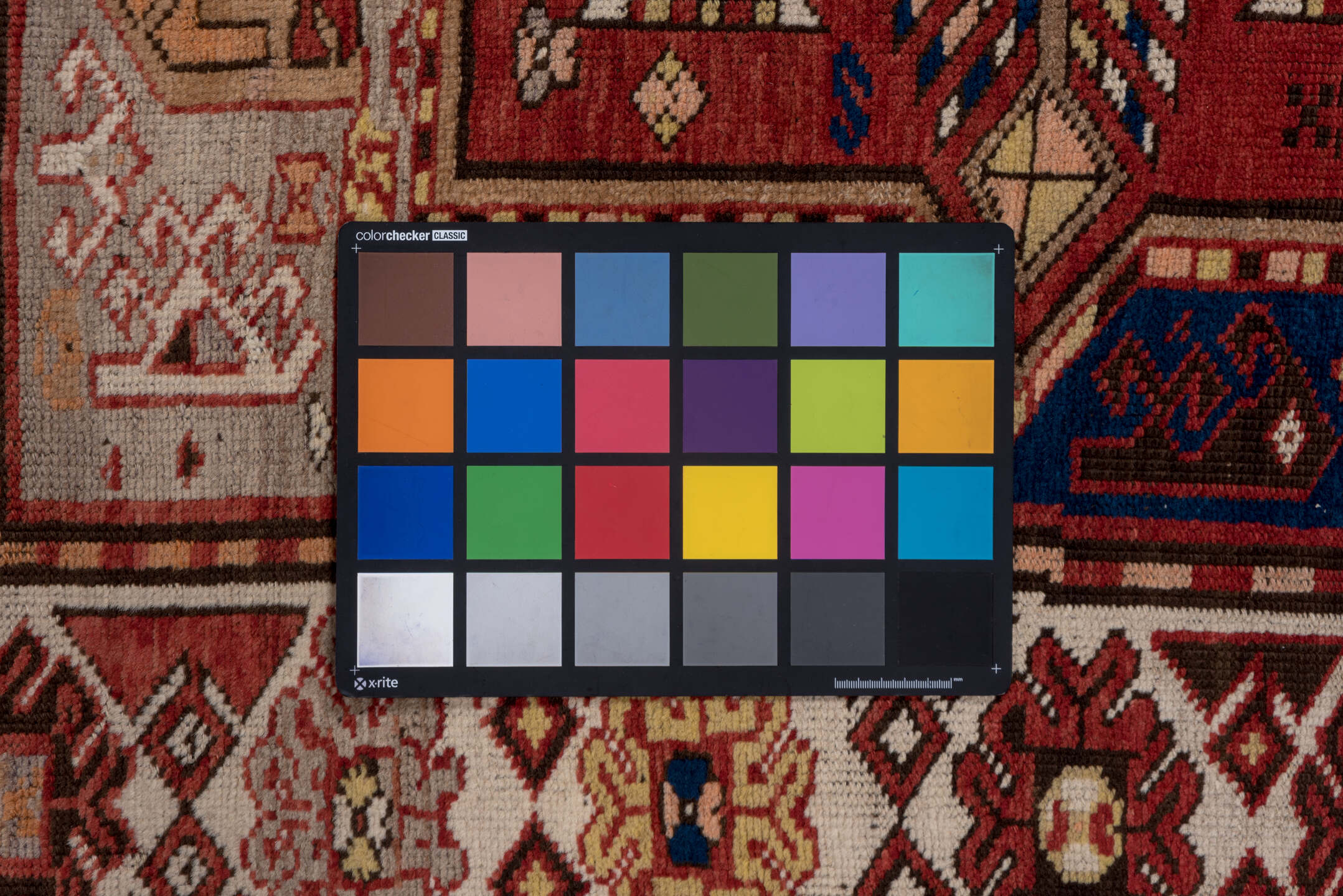 5' x 7' one-of-a-kind handmade vintage Trans Caucasian rug. Color palette: brown, gray, pink, red, redwood