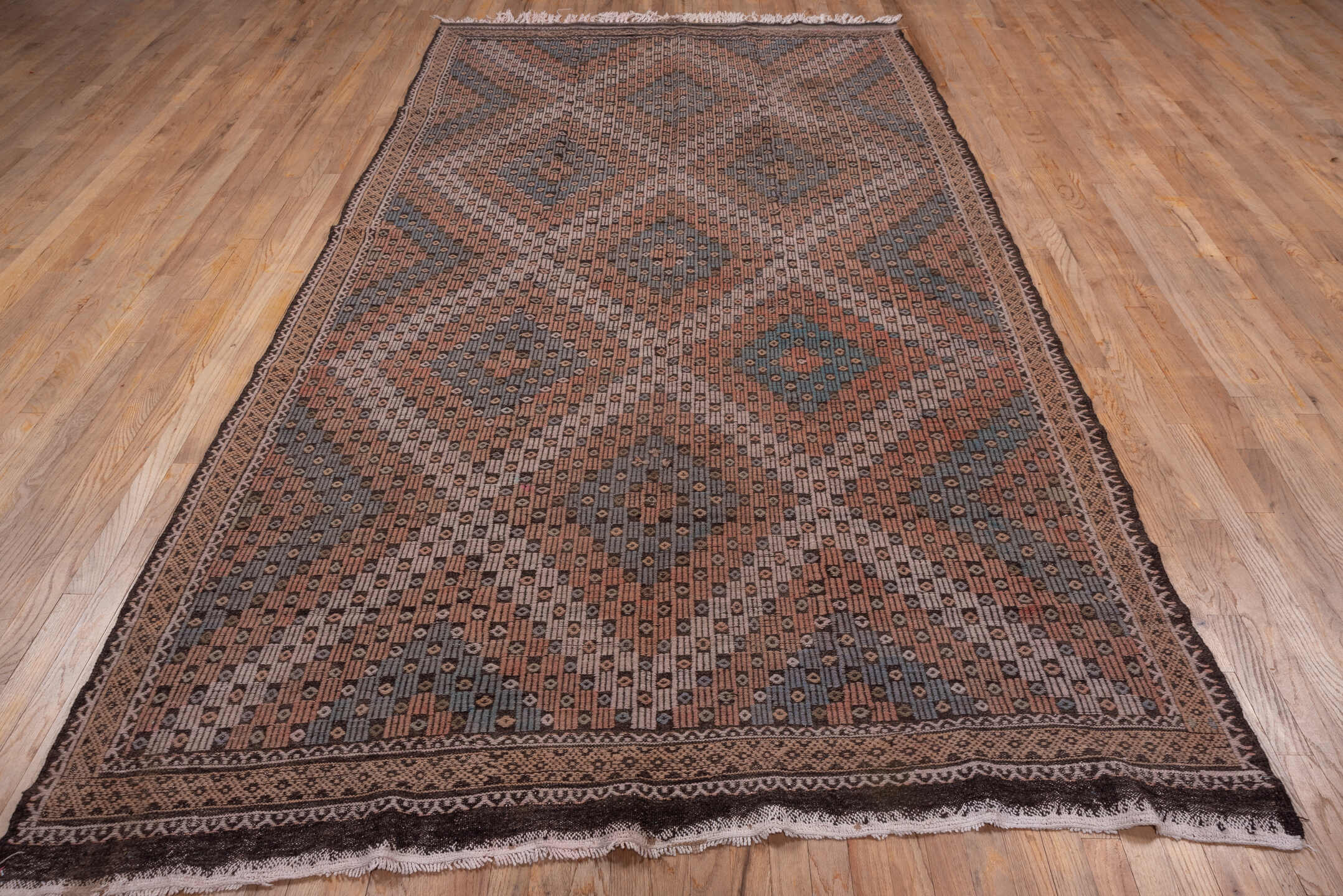 6' x 11' one-of-a-kind handmade vintage Jijim large size rug. Color palette: brown, rust, slate, ivory, charcoal, blue