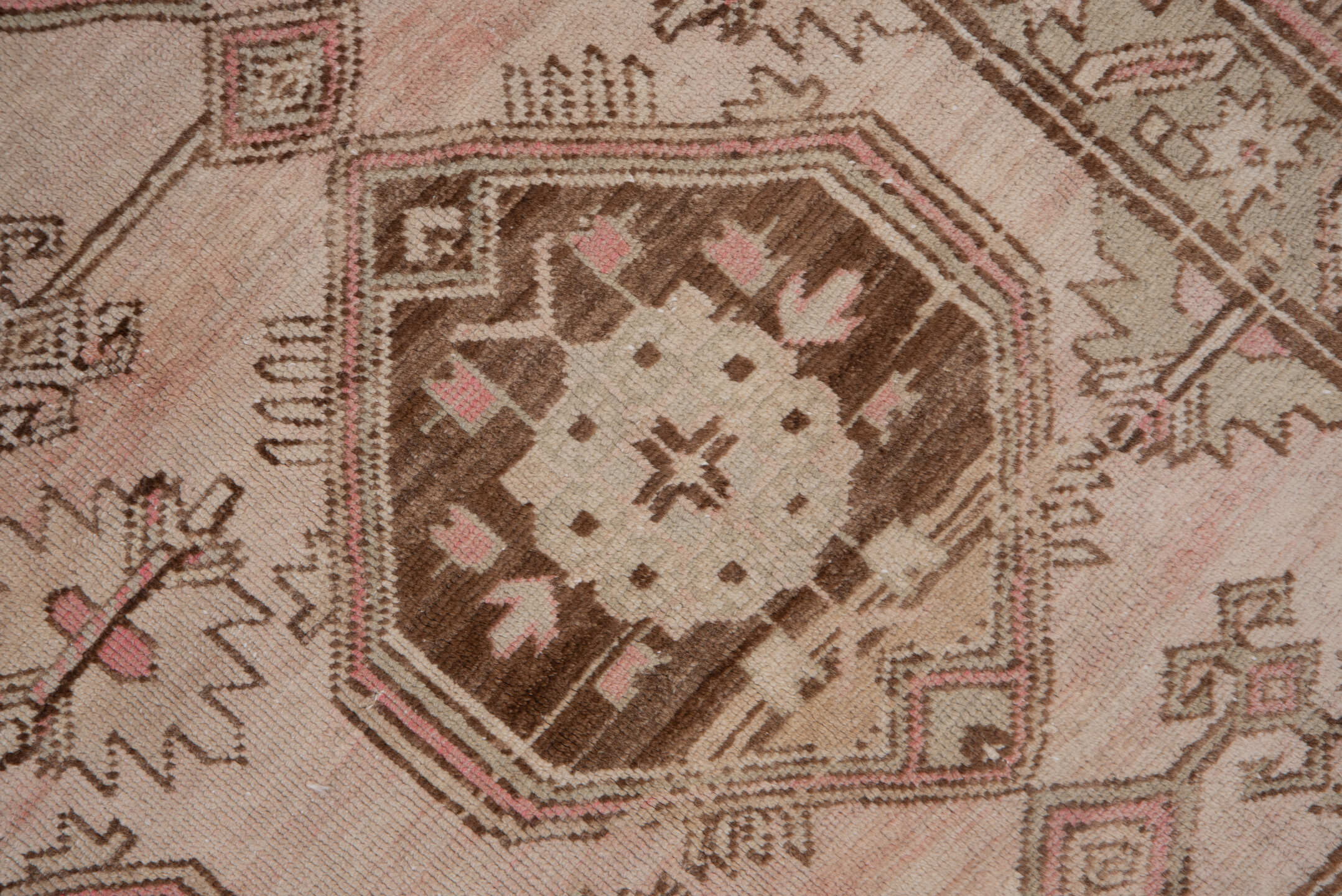 4' x 9' one-of-a-kind handmade antique Trans Caucasian runner rug. Color palette: ivory, taupe, brown, dusty_rose, camel