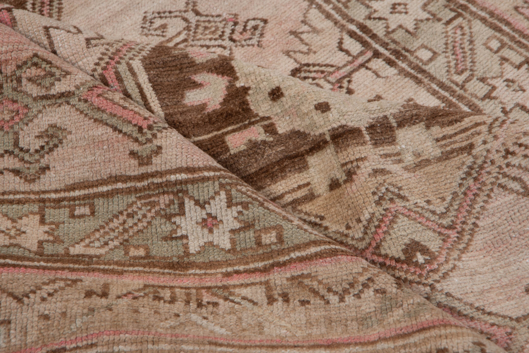 4' x 9' one-of-a-kind handmade antique Trans Caucasian runner rug. Color palette: ivory, taupe, brown, dusty_rose, camel