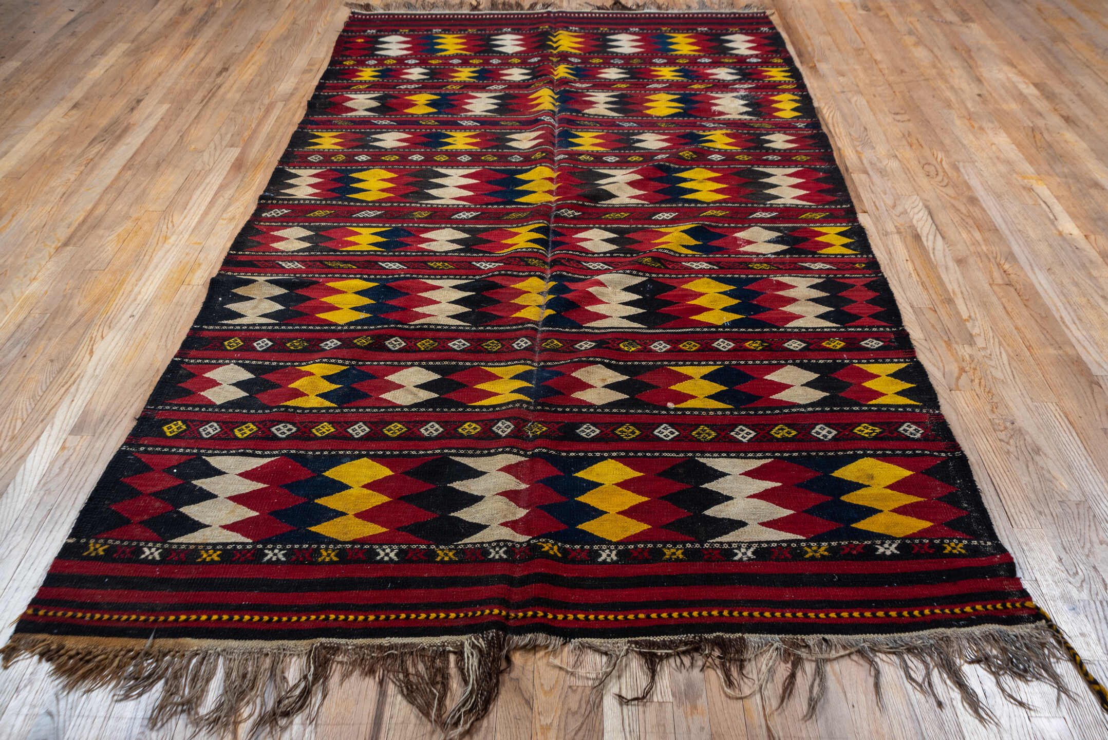 5' x 10' one-of-a-kind handmade vintage Kilim medium size rug. Color palette: crimson, ivory, gold, navy, charcoal, burgundy