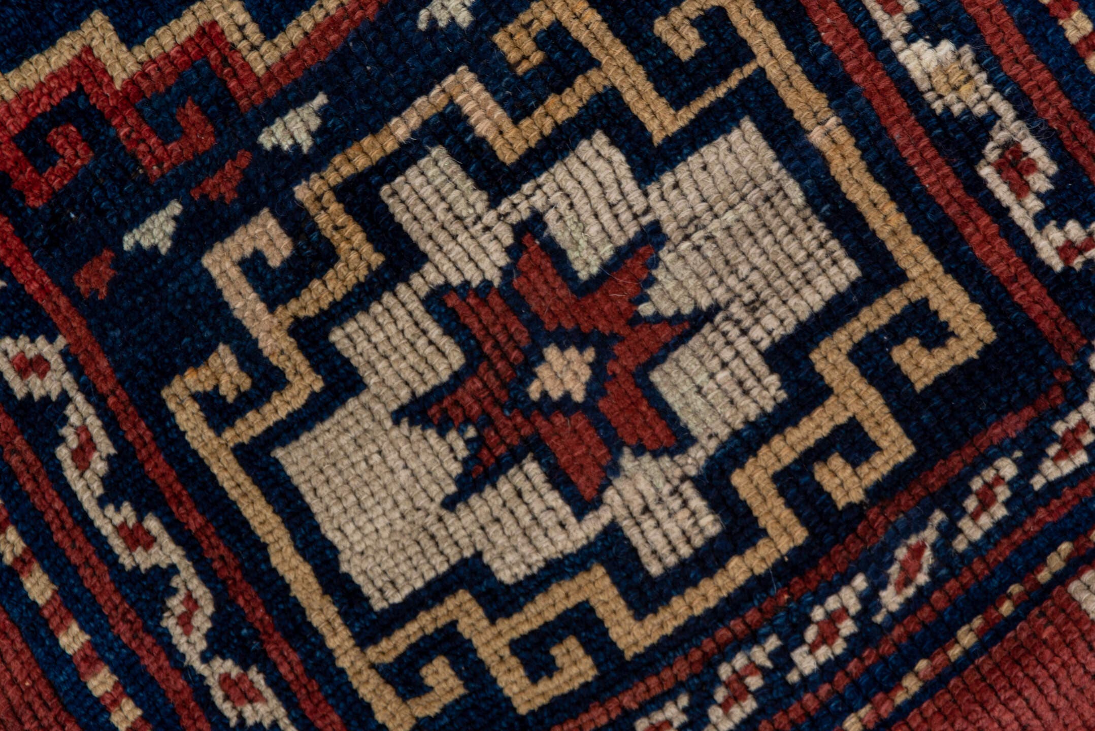 4' x 6' one-of-a-kind handmade antique Trans Caucasian small size rug. Color palette: rust, navy, ivory, crimson, indigo