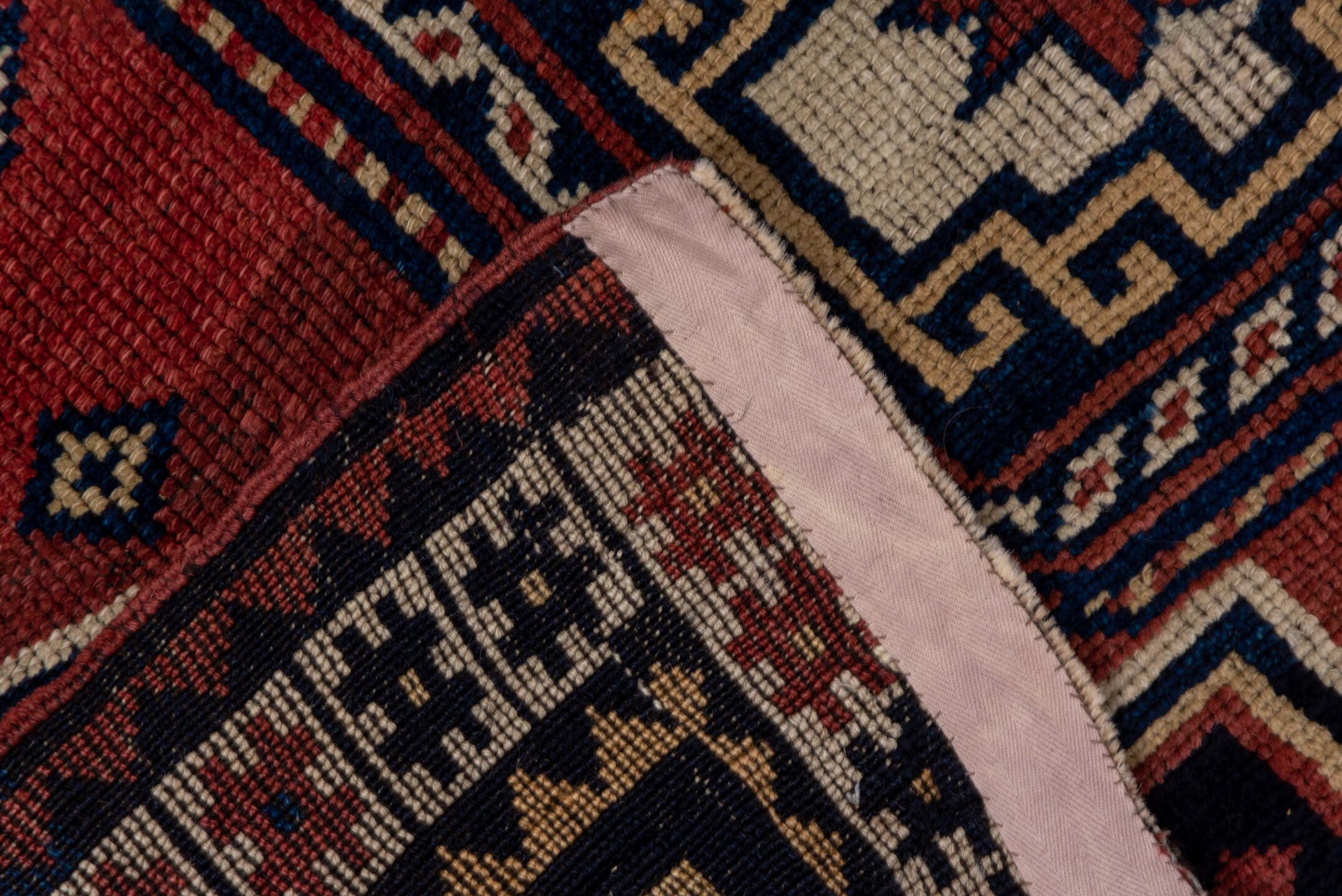 4' x 6' one-of-a-kind handmade antique Trans Caucasian small size rug. Color palette: rust, navy, ivory, crimson, indigo