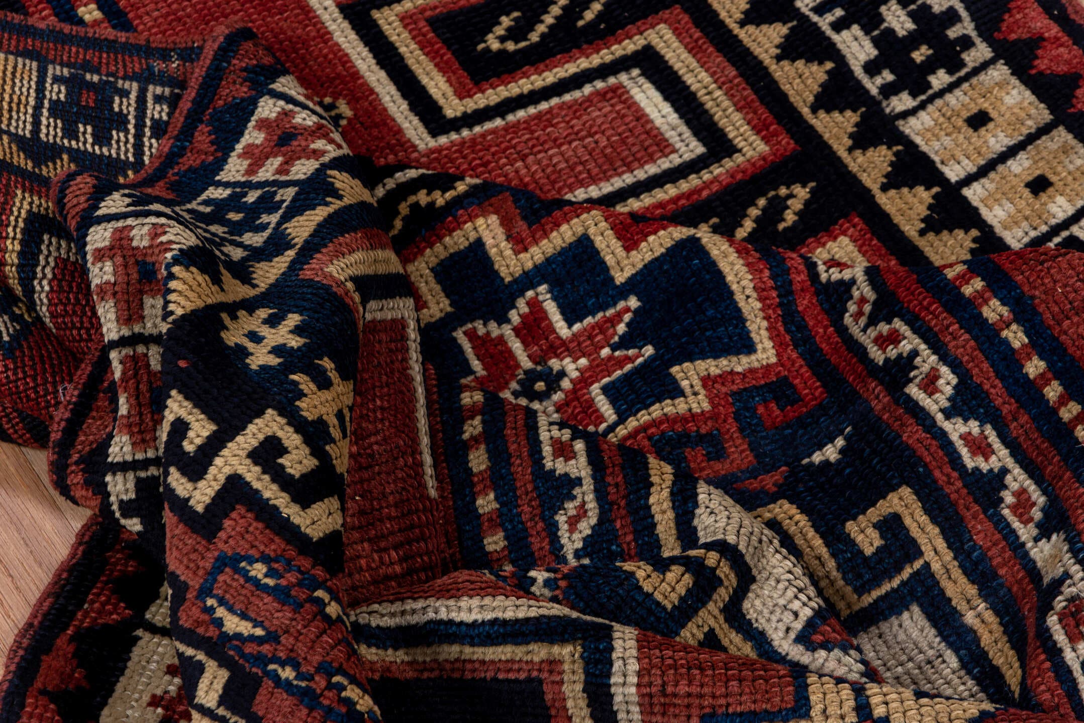 4' x 6' one-of-a-kind handmade antique Trans Caucasian small size rug. Color palette: rust, navy, ivory, crimson, indigo