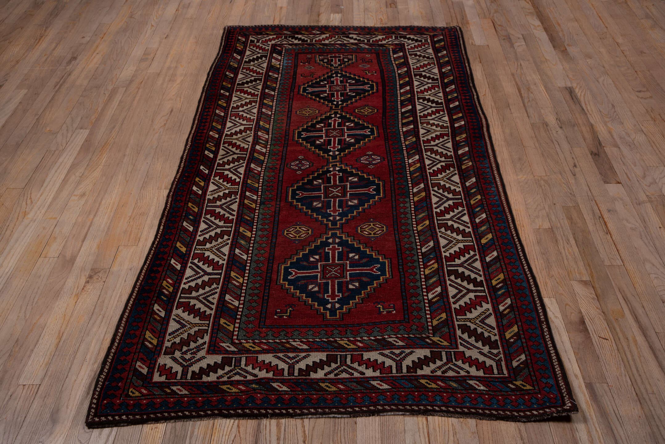 9' x 11' one-of-a-kind handmade vintage Afghan large size rug. Color palette: rust, navy, ivory, crimson, camel, charcoal