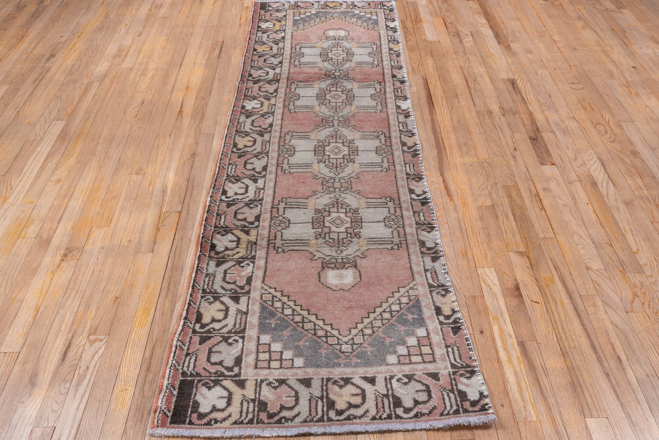 2' x 9' one-of-a-kind handmade vintage Oushak runner rug. Color palette: rose, ivory, charcoal, taupe, dusty blue, camel