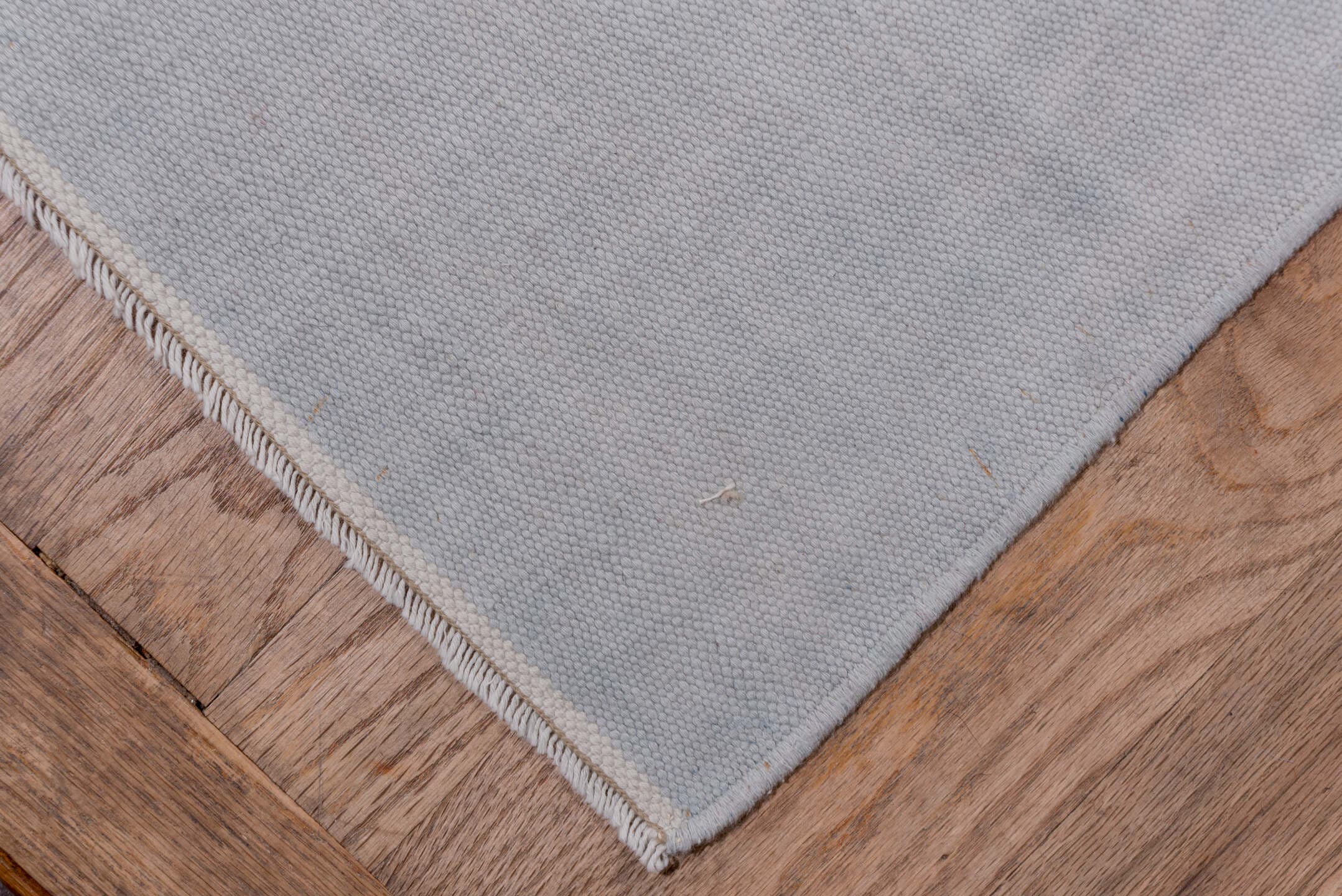 9' x 17' one-of-a-kind handmade antique Dhurrie rug. Color palette: pale blue, ivory, sky blue, light blue